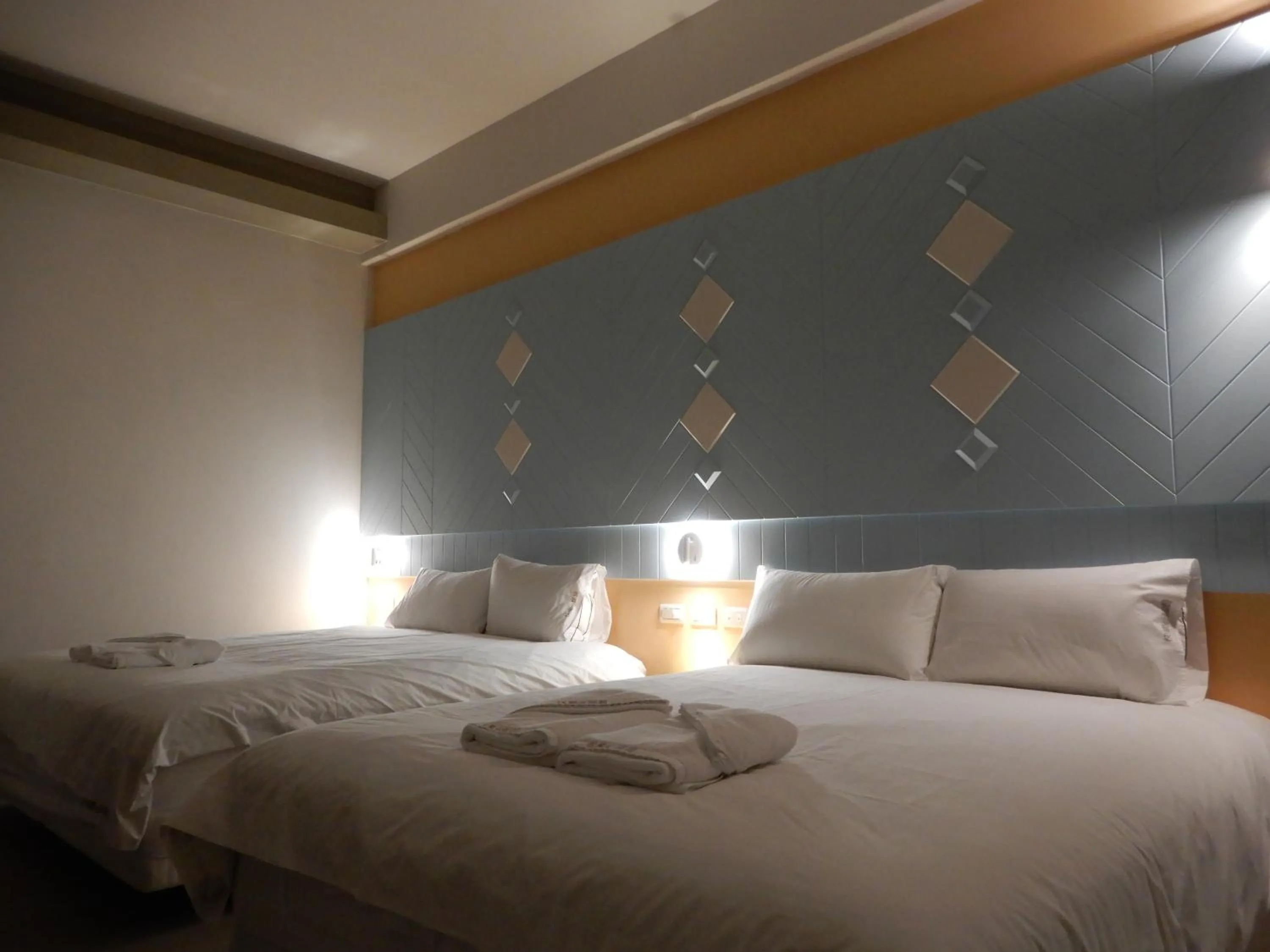 Bed in Happy Wing Guesthouse