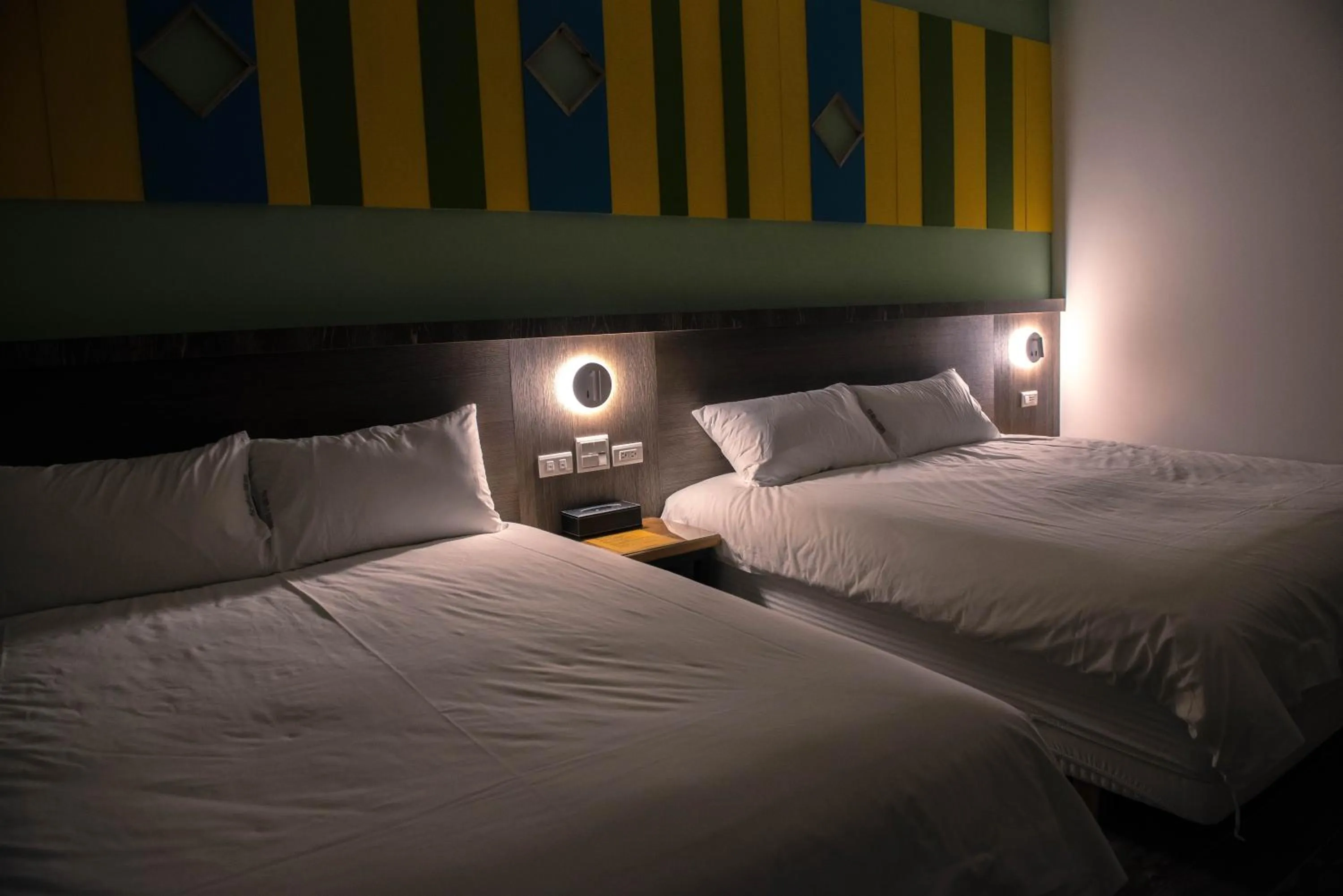 Bed in Happy Wing Guesthouse