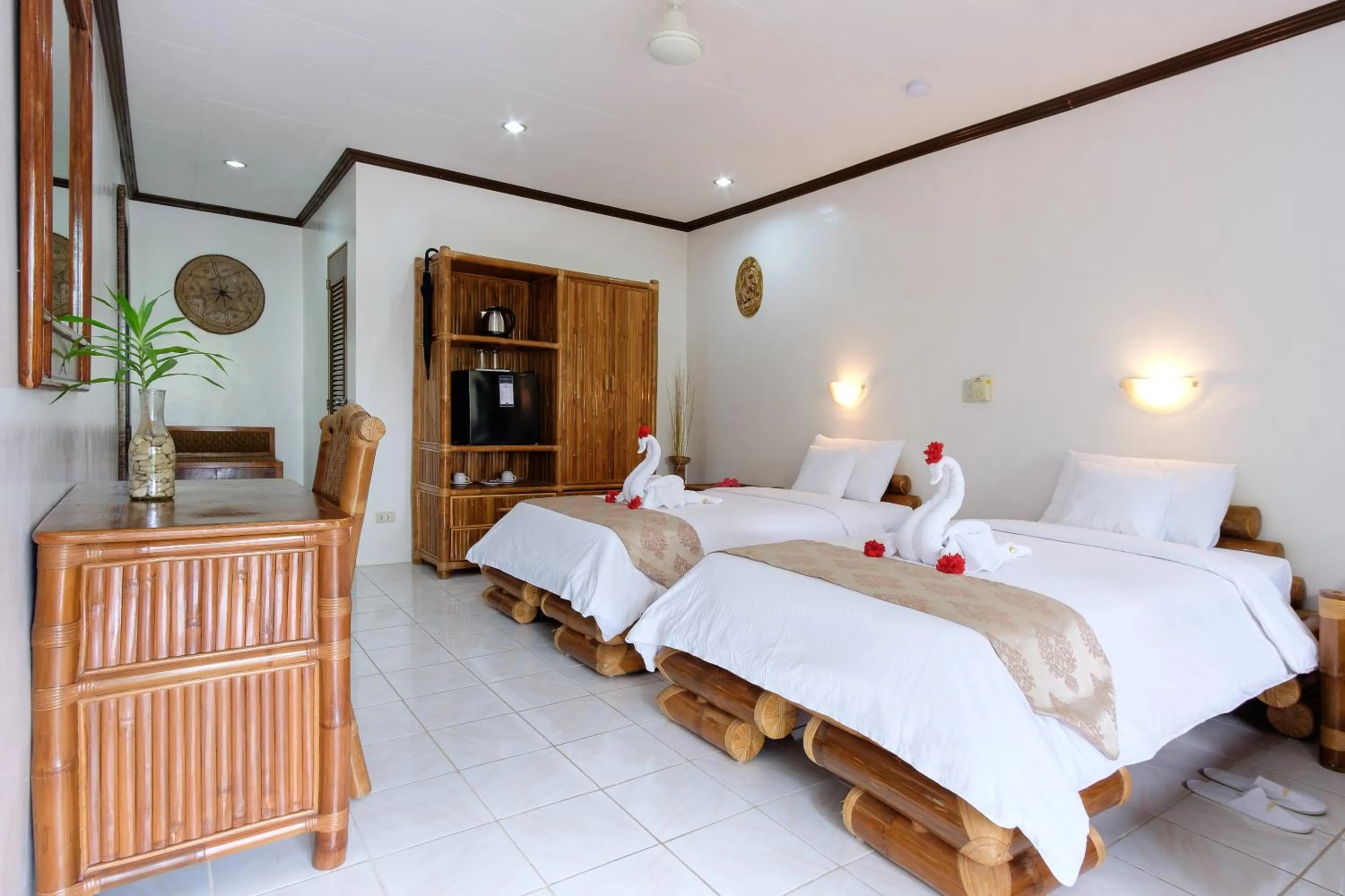 Bed in Kasai Village Dive Resort