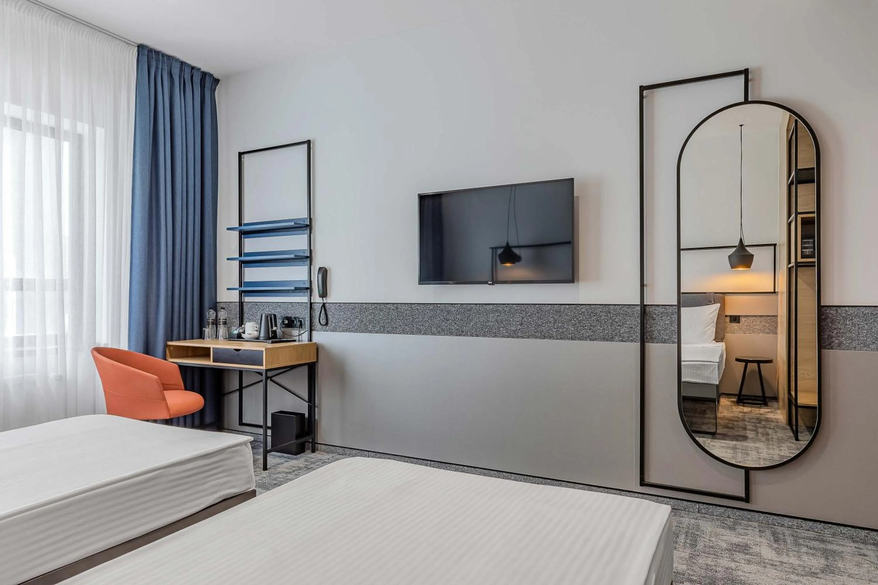 Seating area, Bed in IQ Hotel