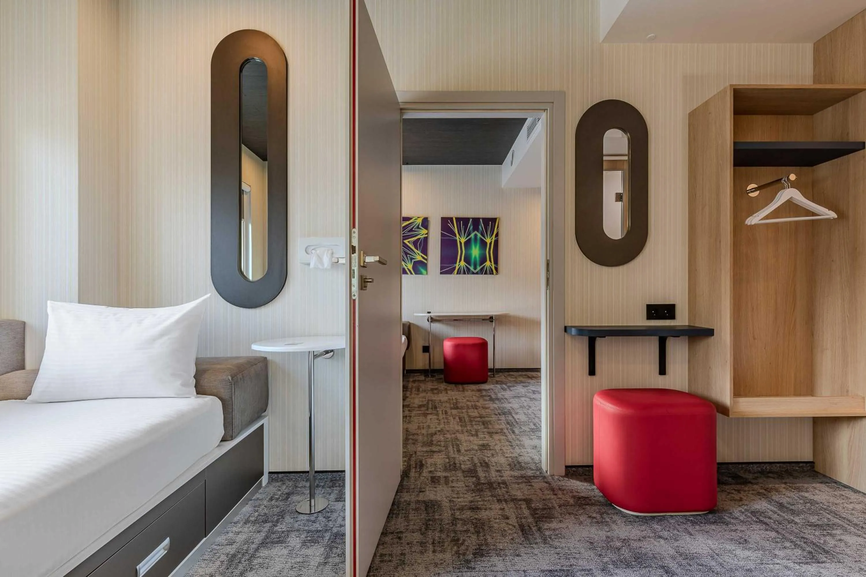 Living room, Bed in IQ Hotel