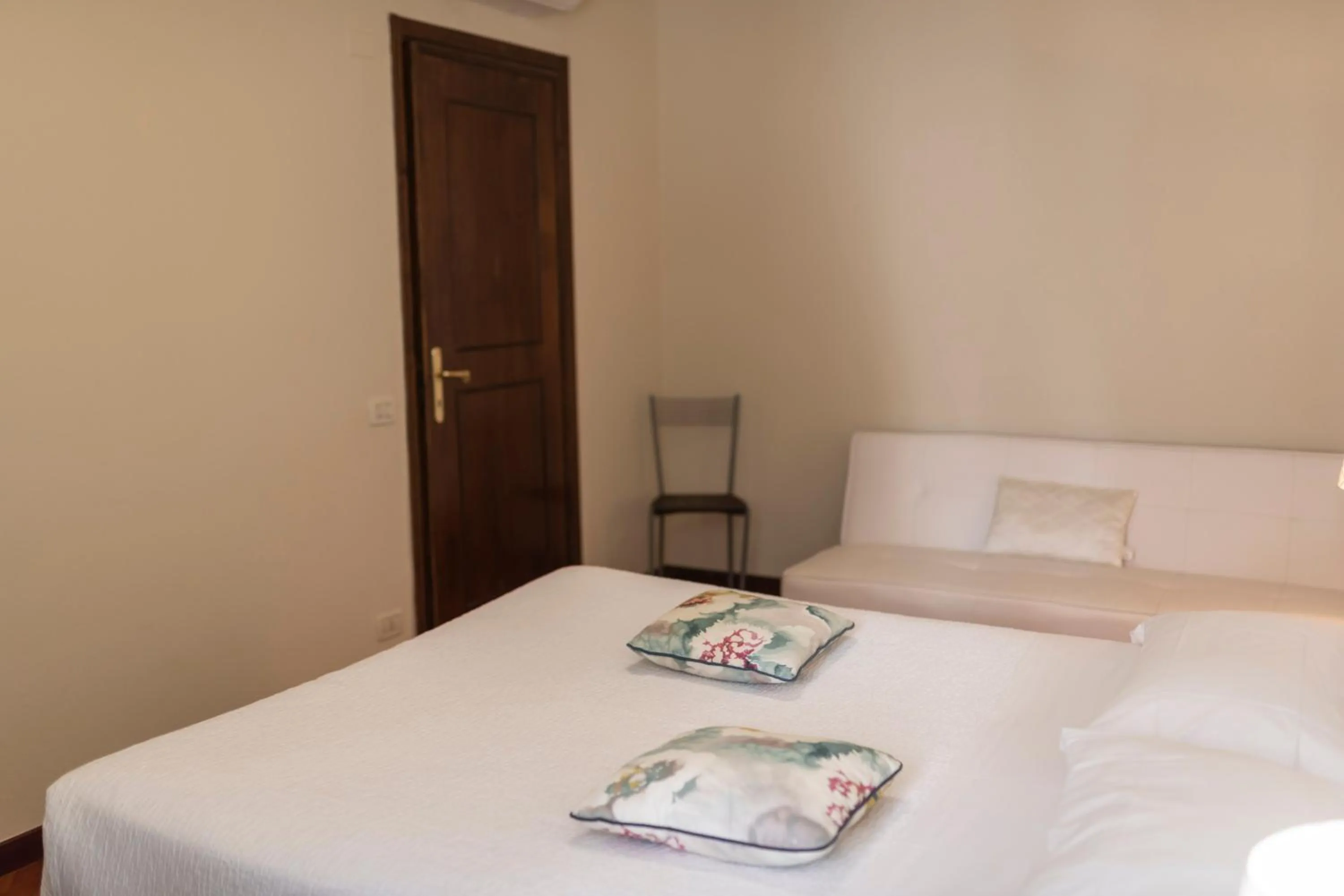 Bed in Aromi Piccolo Hotel