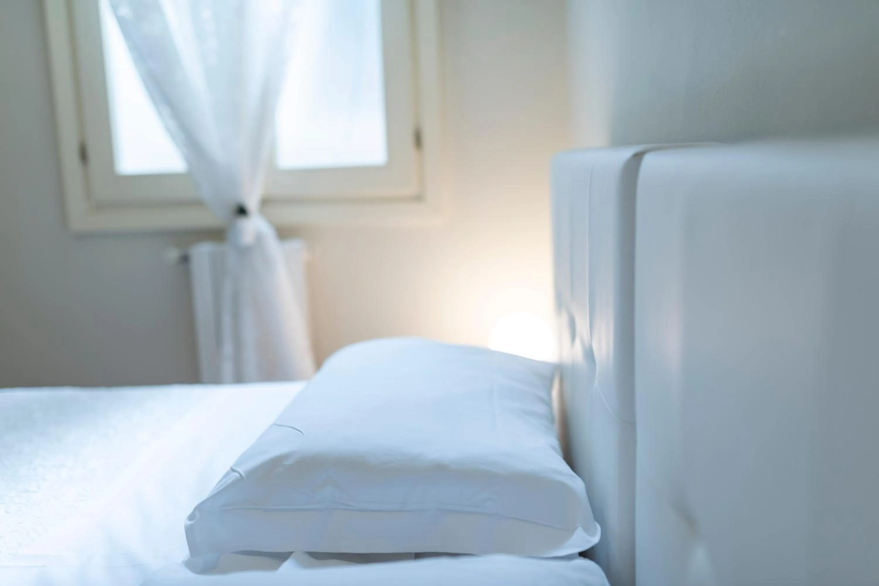 Bed in Aromi Piccolo Hotel