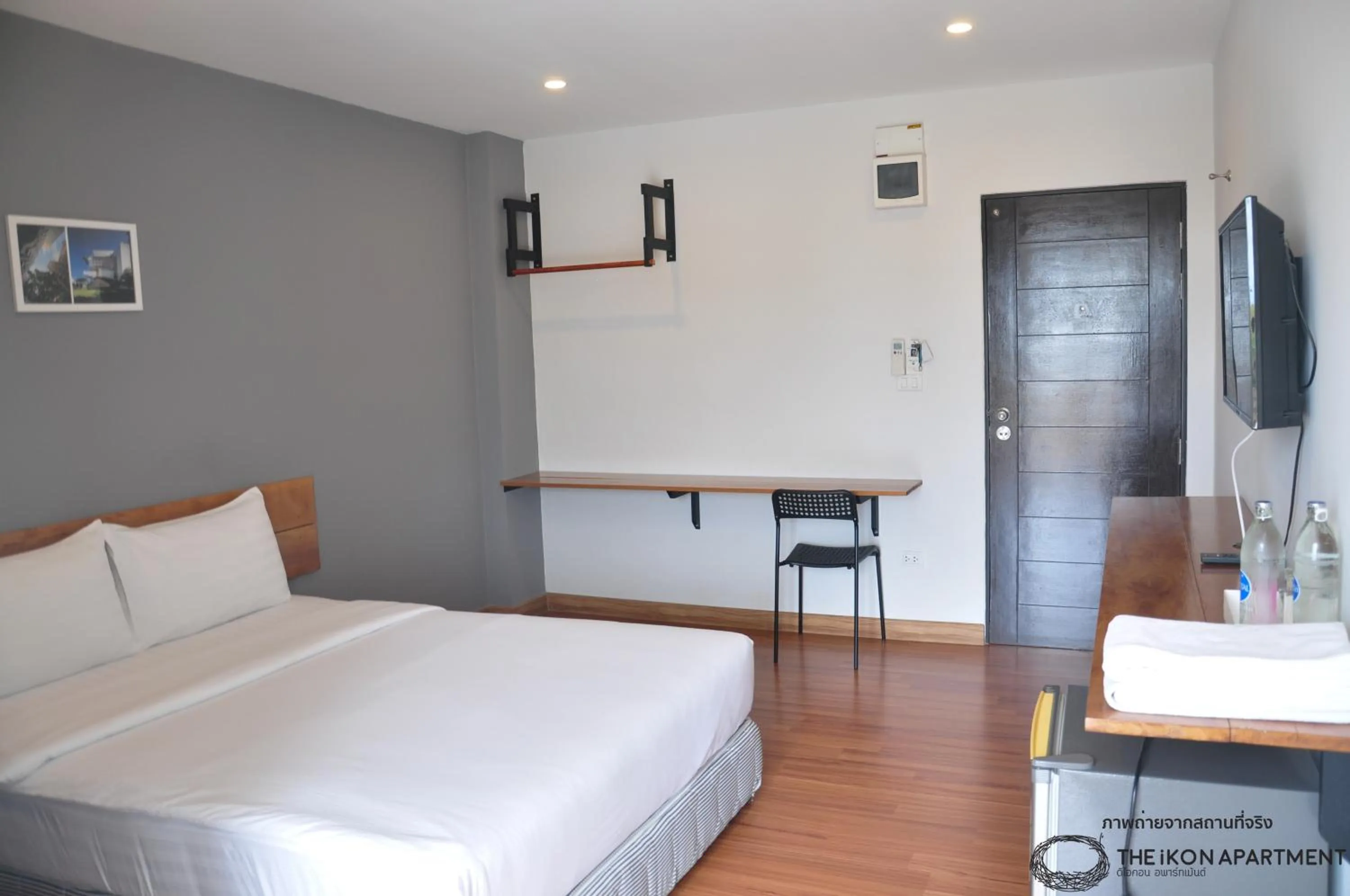 Bed in The iKon Apartment