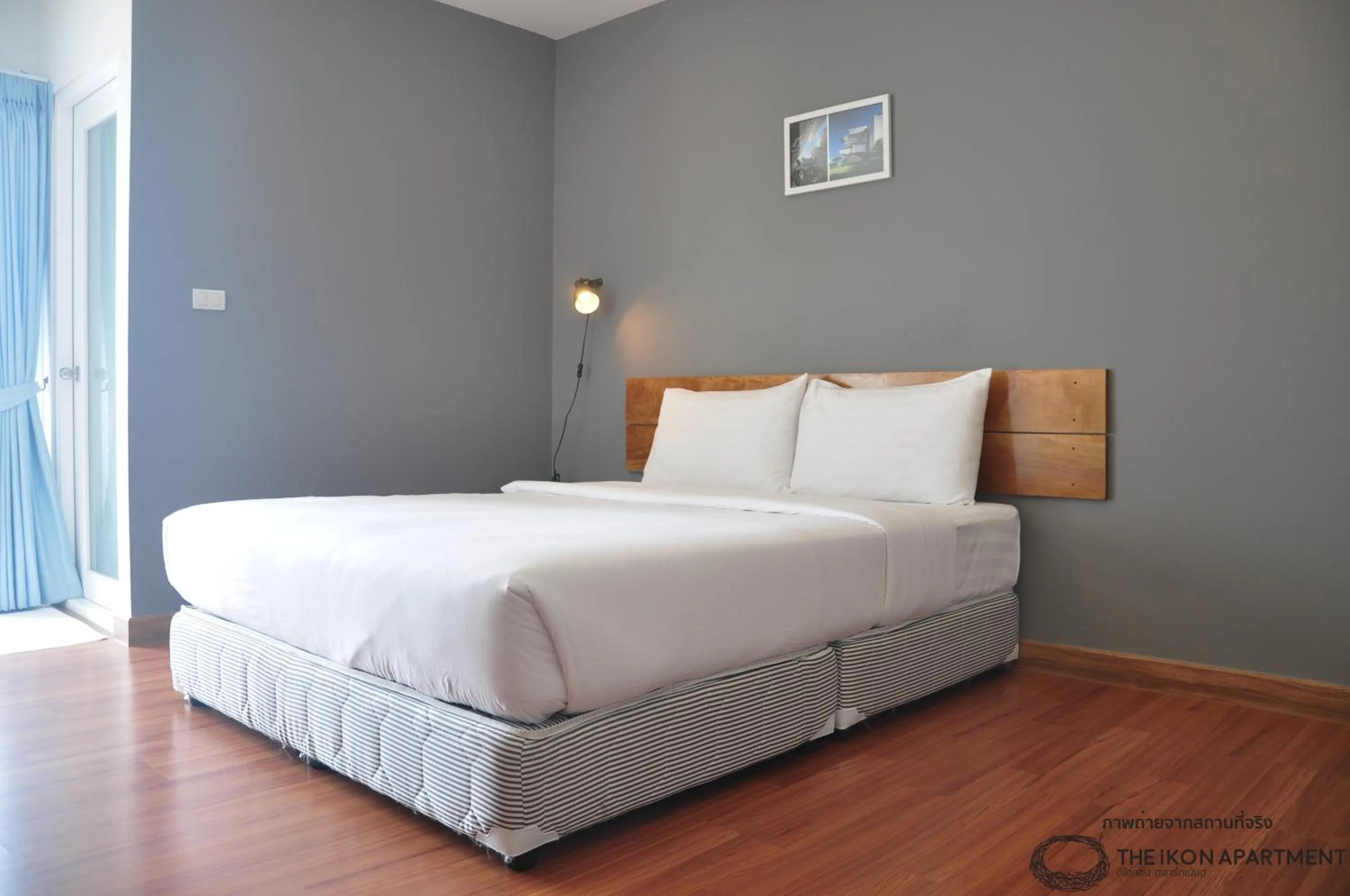 Bed in The iKon Apartment