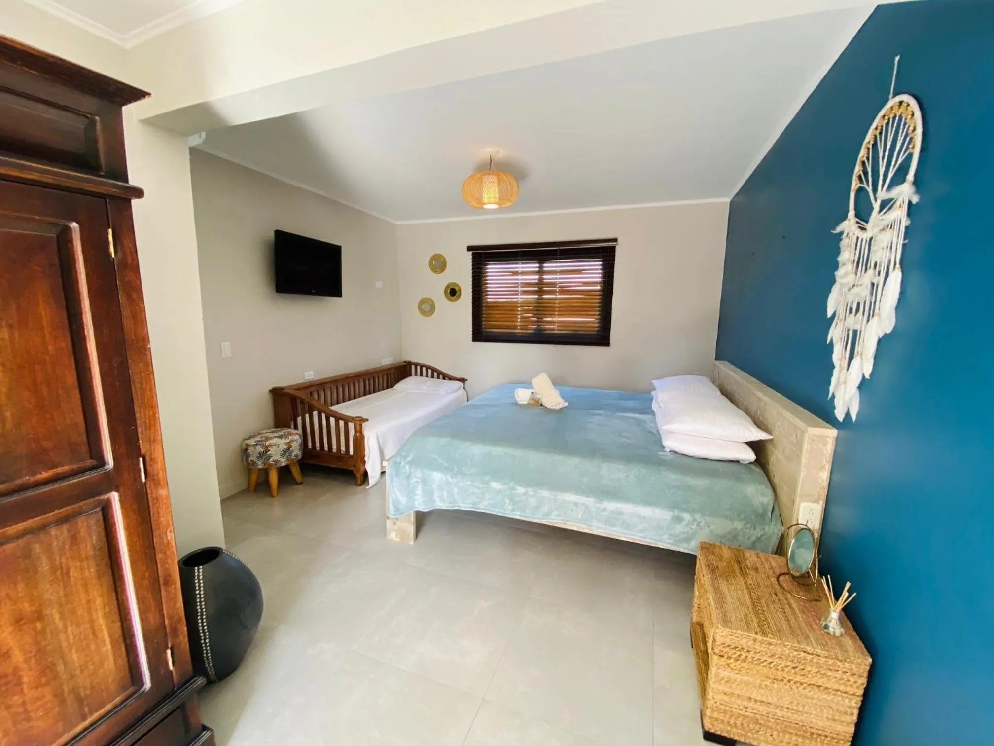 Bed in Arubiana Inn Hotel