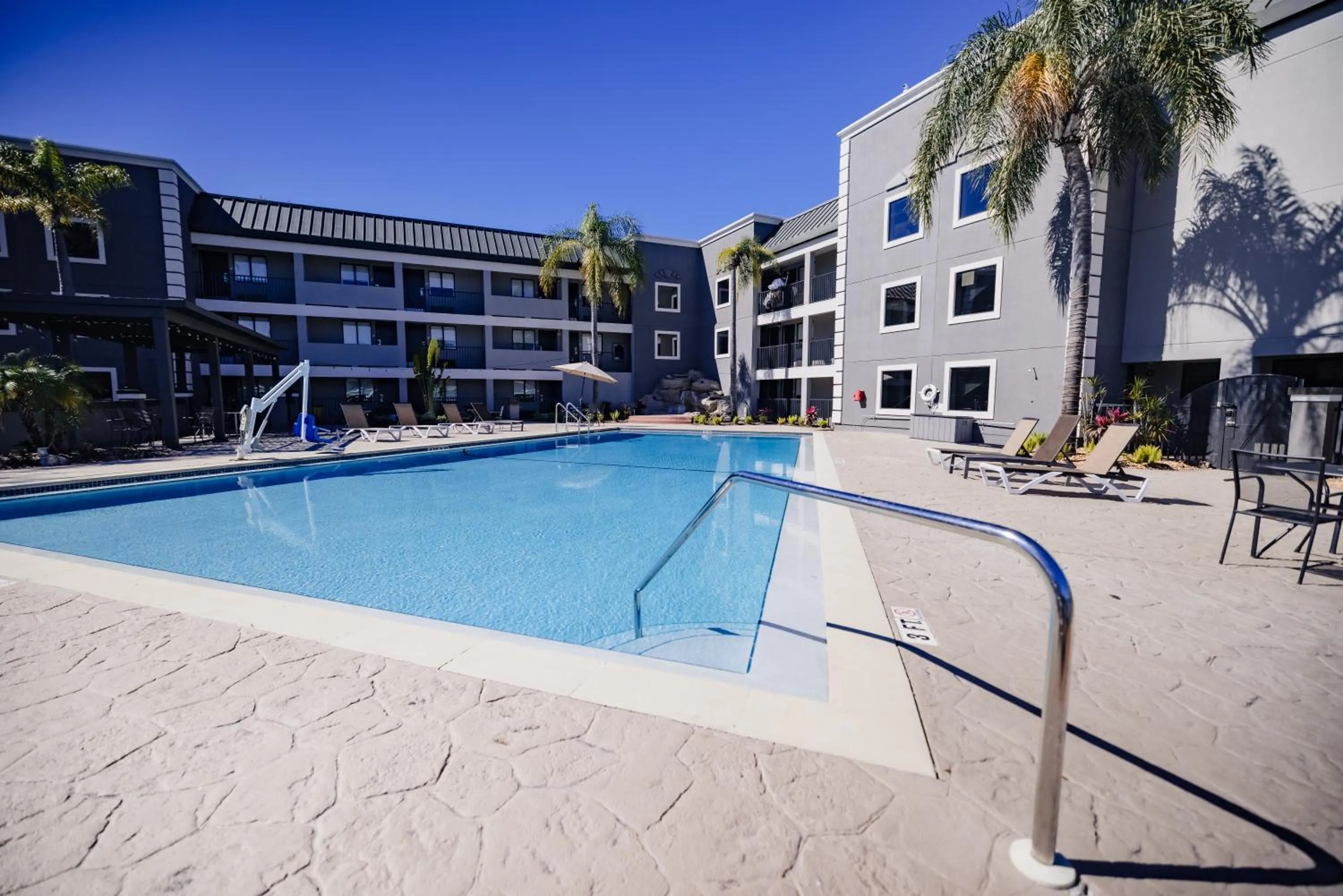 Swimming pool in La Quinta Inn by Wyndham Tampa Near Busch Gardens