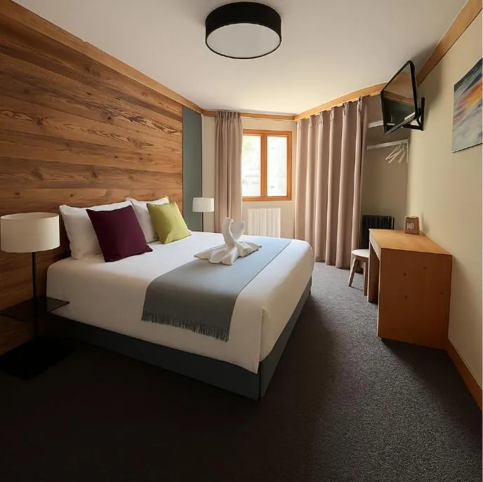 Bed in Hillary Hotel