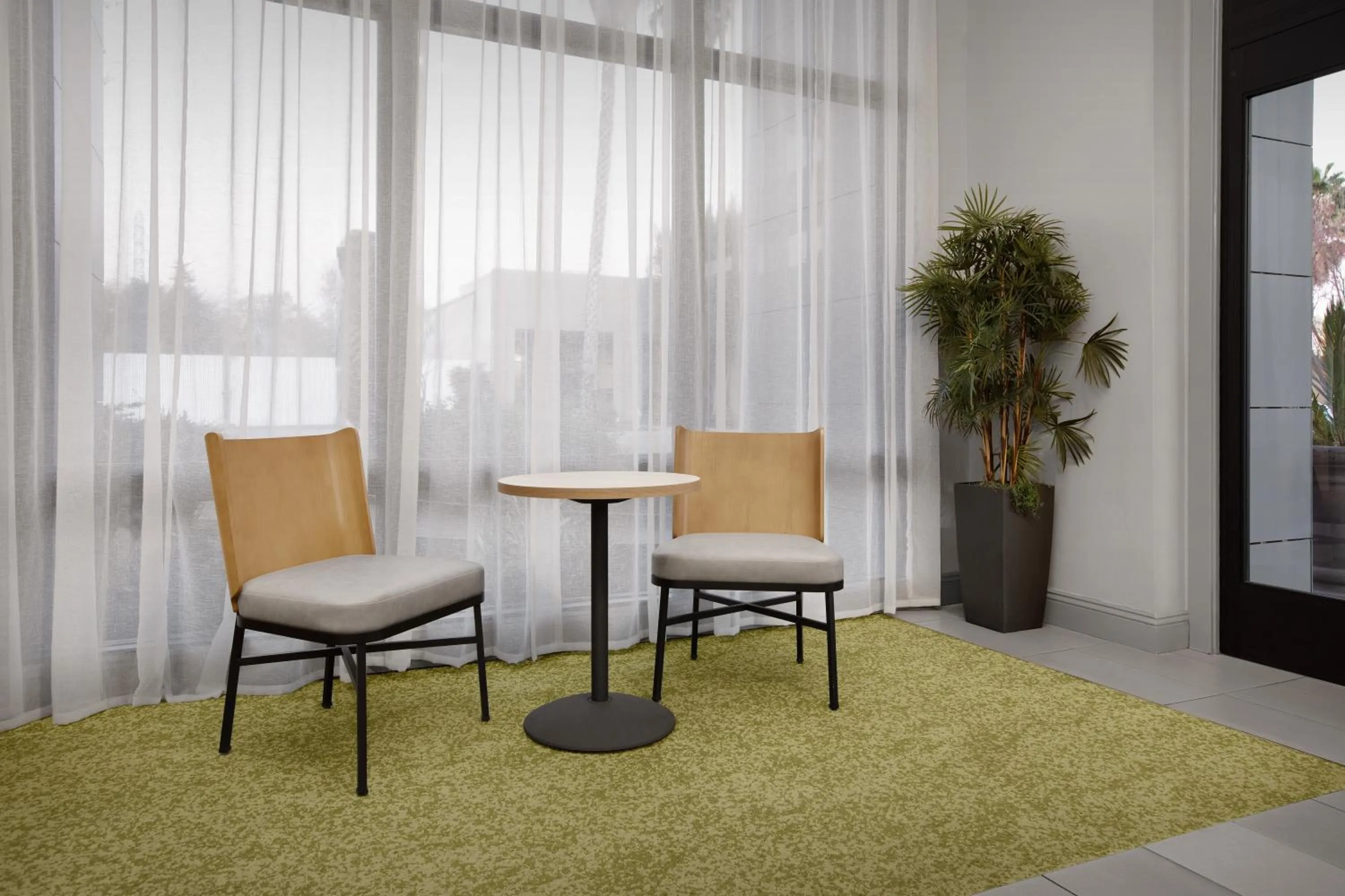 Seating area in Spark by Hilton San Jose Airport