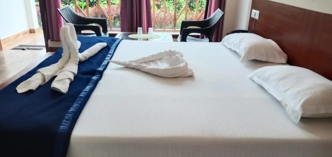 Bed in Hotel Exotica Squares