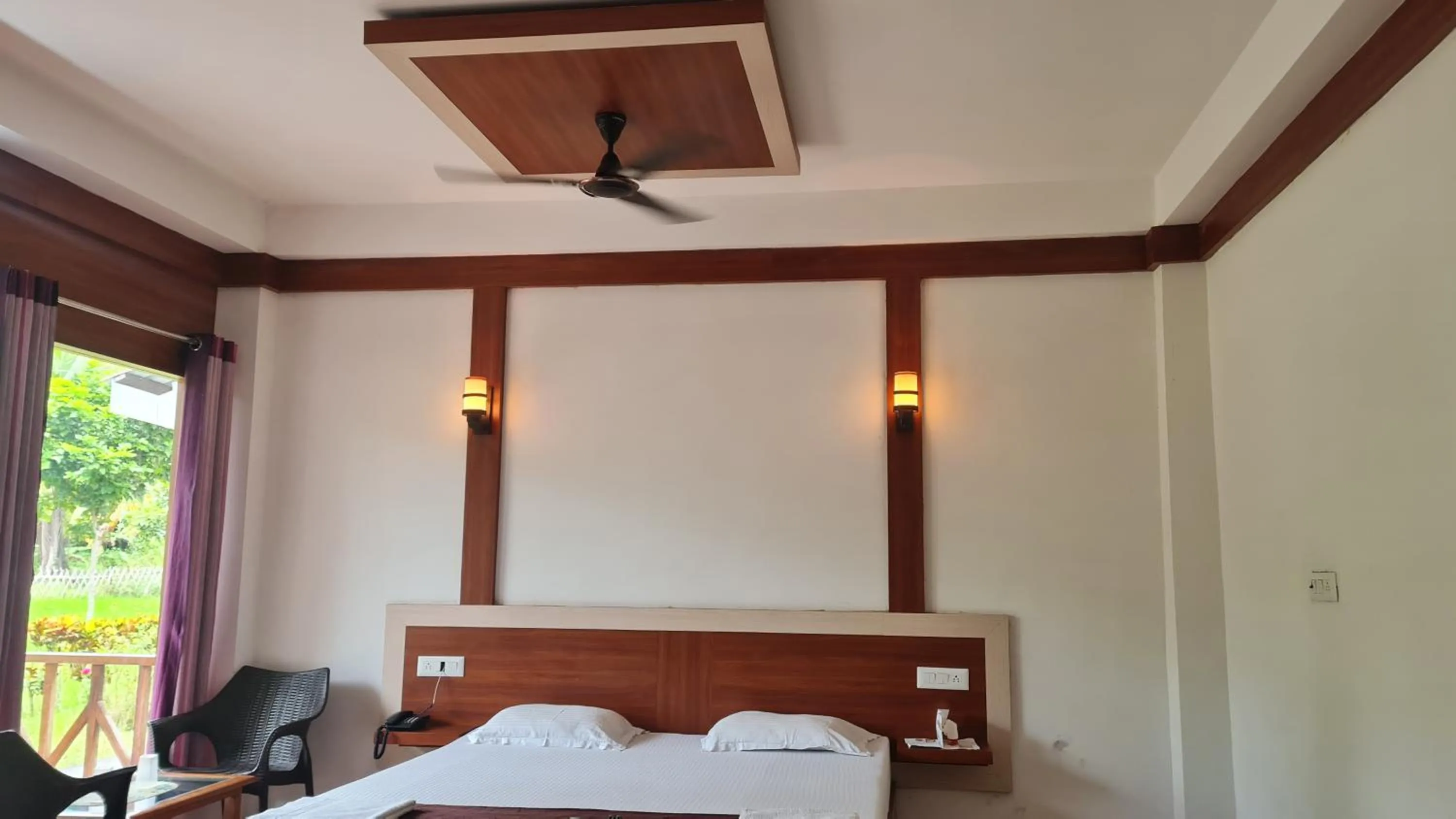 fireplace, Bed in Hotel Exotica Squares