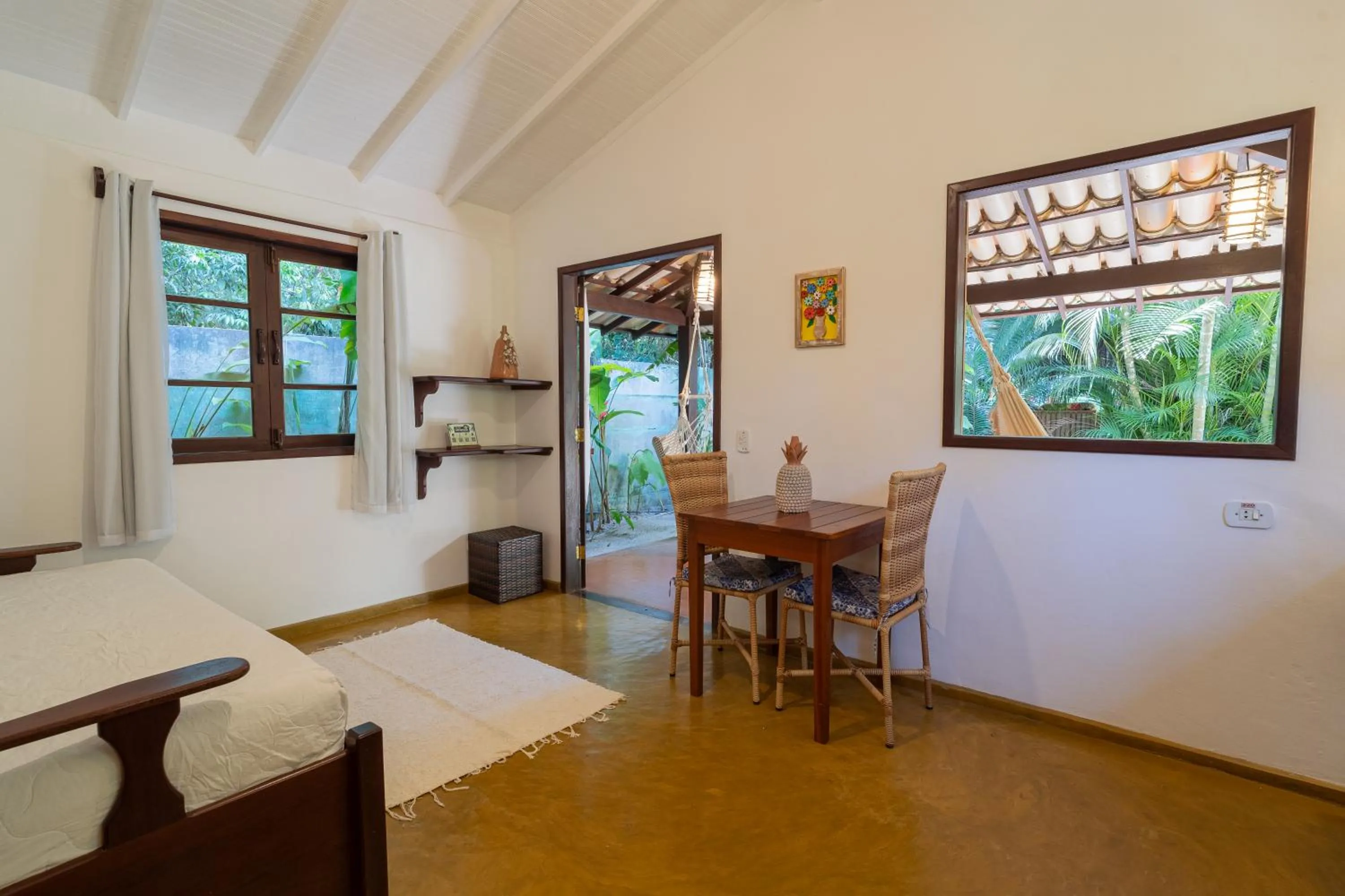 Living room, Bed in Pousada Samambaia