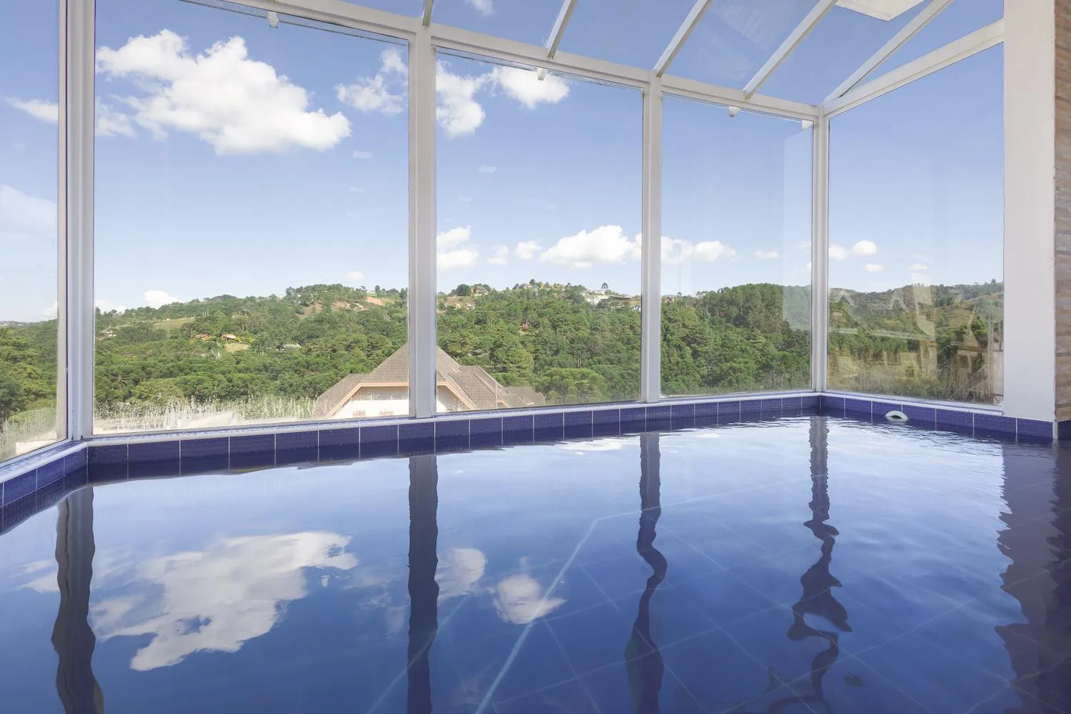 Swimming pool in Kaliman Pousada Campos do Jordão