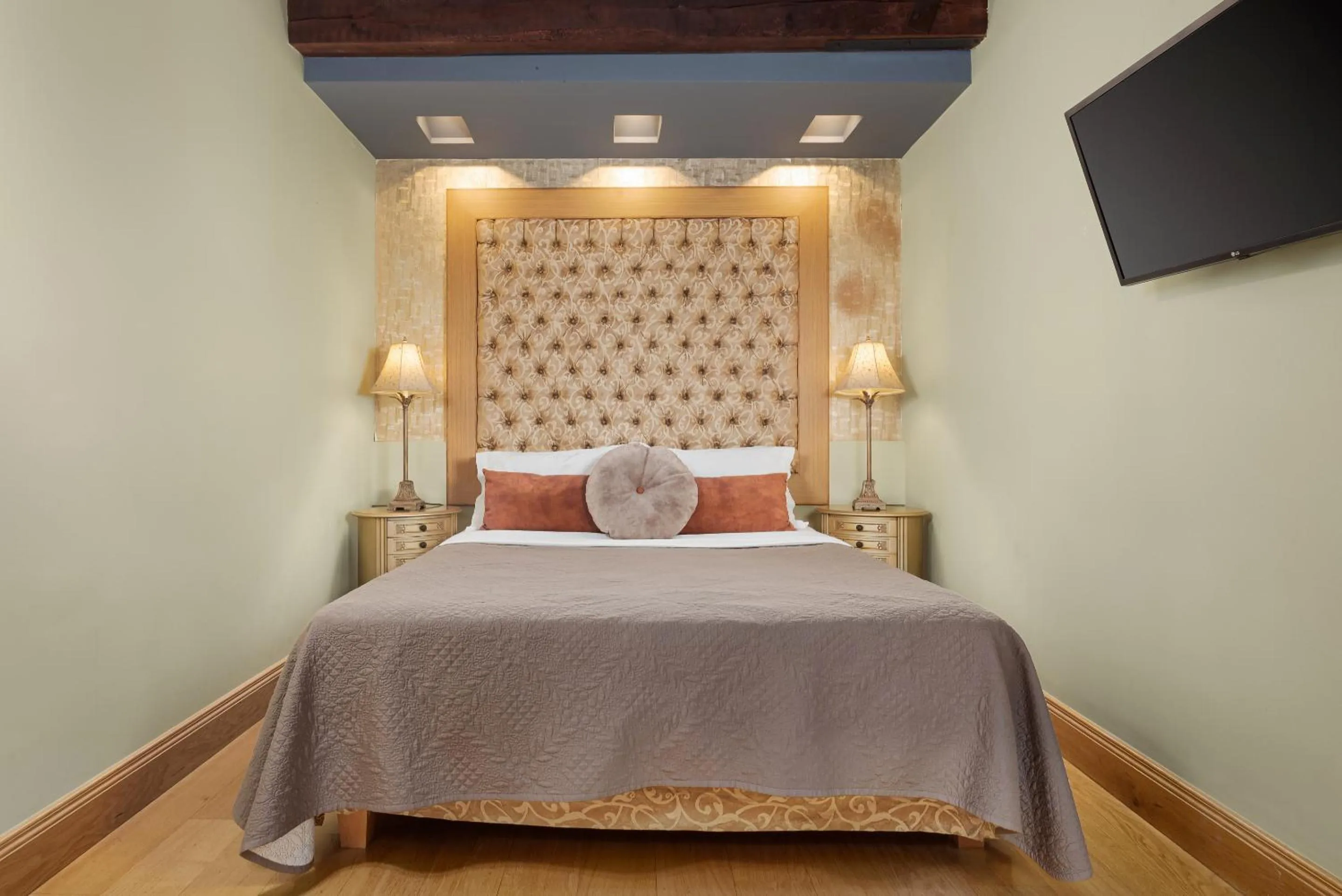 Bed in Civitas Suites Hotel