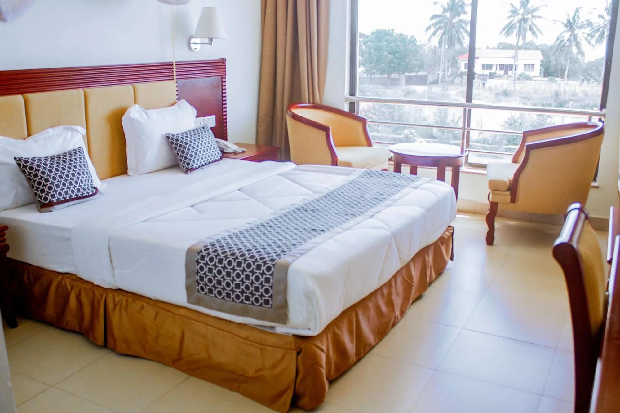 Bed in Luwa Evergreen Hotel