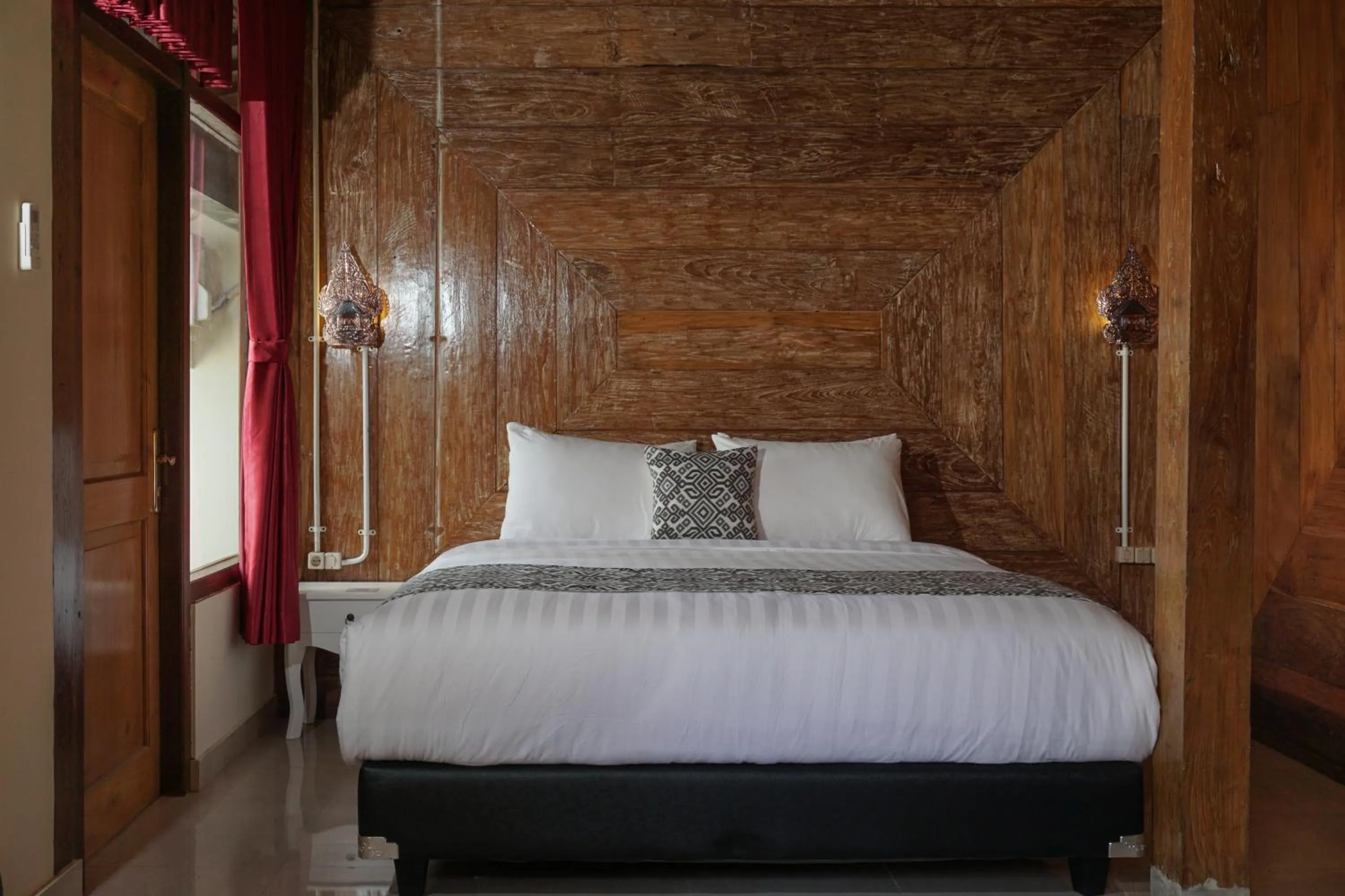 Bed in Kampoeng Joglo Boutique Hotel