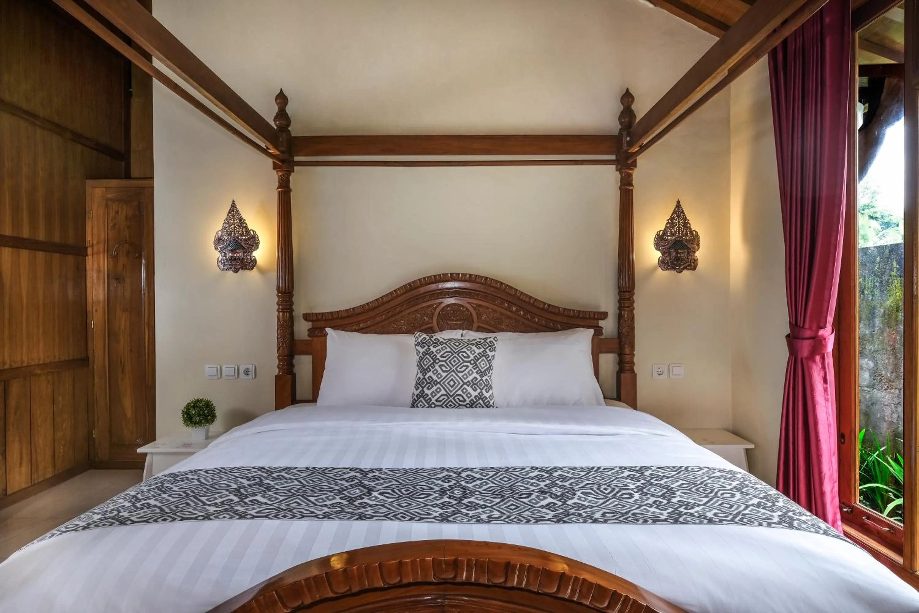 Bed in Kampoeng Joglo Boutique Hotel