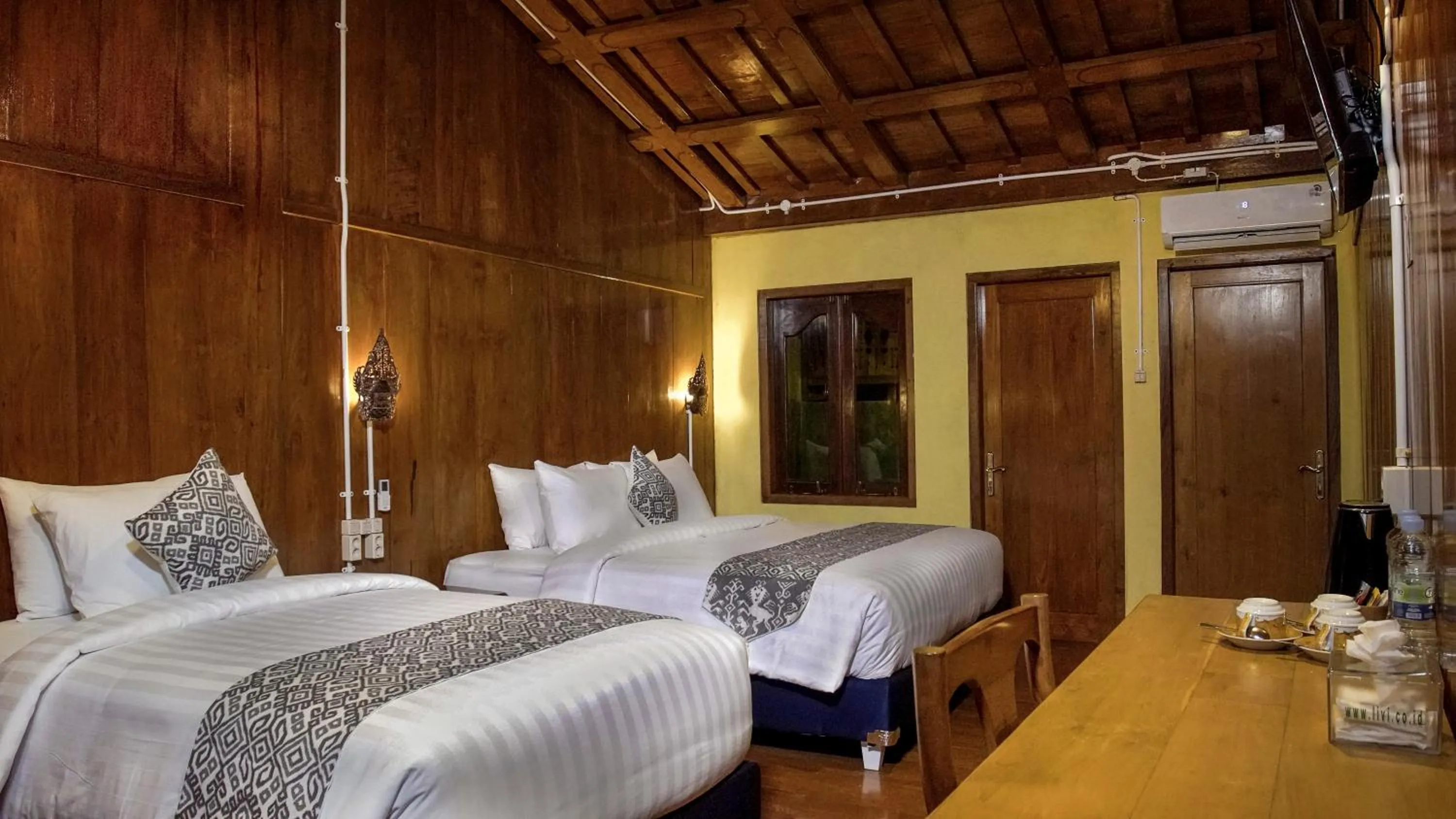 Bed in Kampoeng Joglo Boutique Hotel