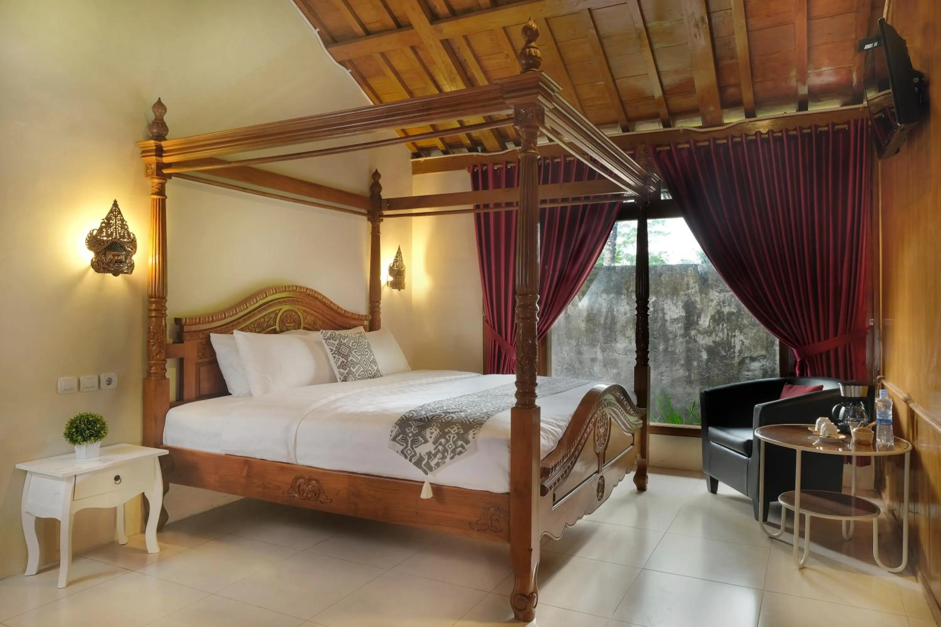 Bed in Kampoeng Joglo Boutique Hotel