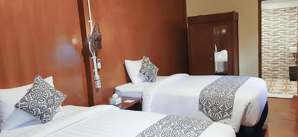 Bed in Kampoeng Joglo Boutique Hotel