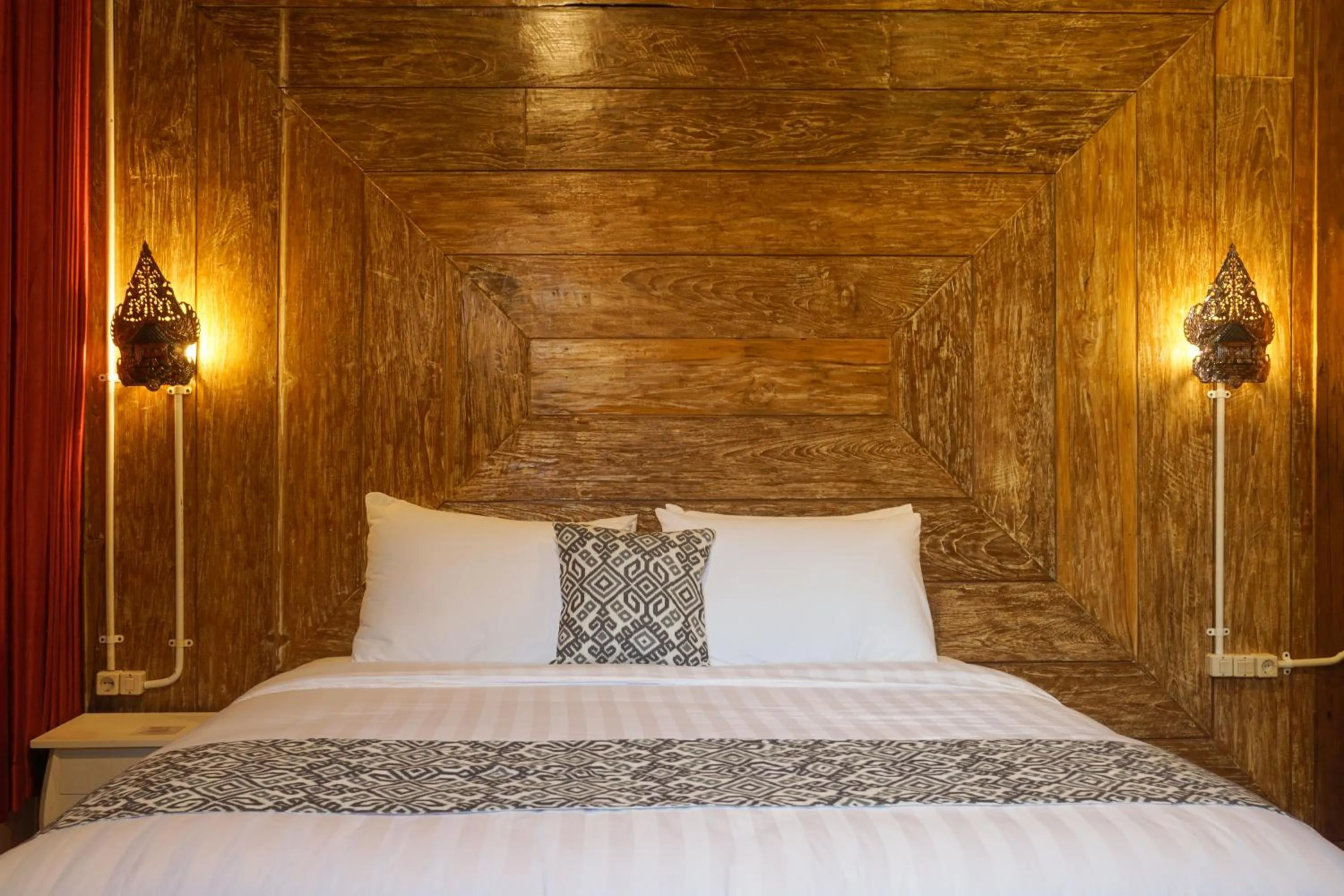 Bed in Kampoeng Joglo Boutique Hotel