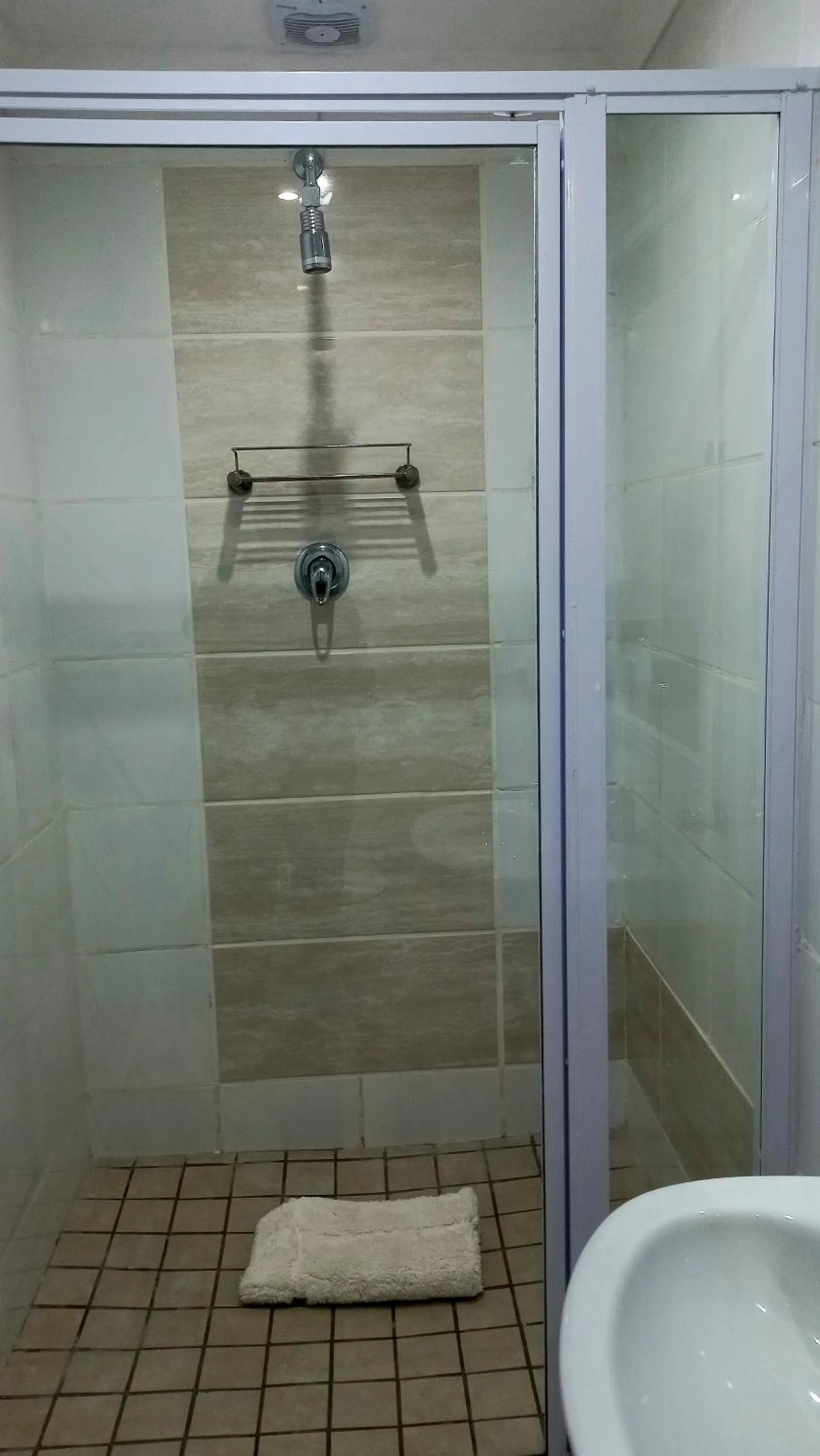 Shower in Phoenix Lodge and Waterside Accommodation