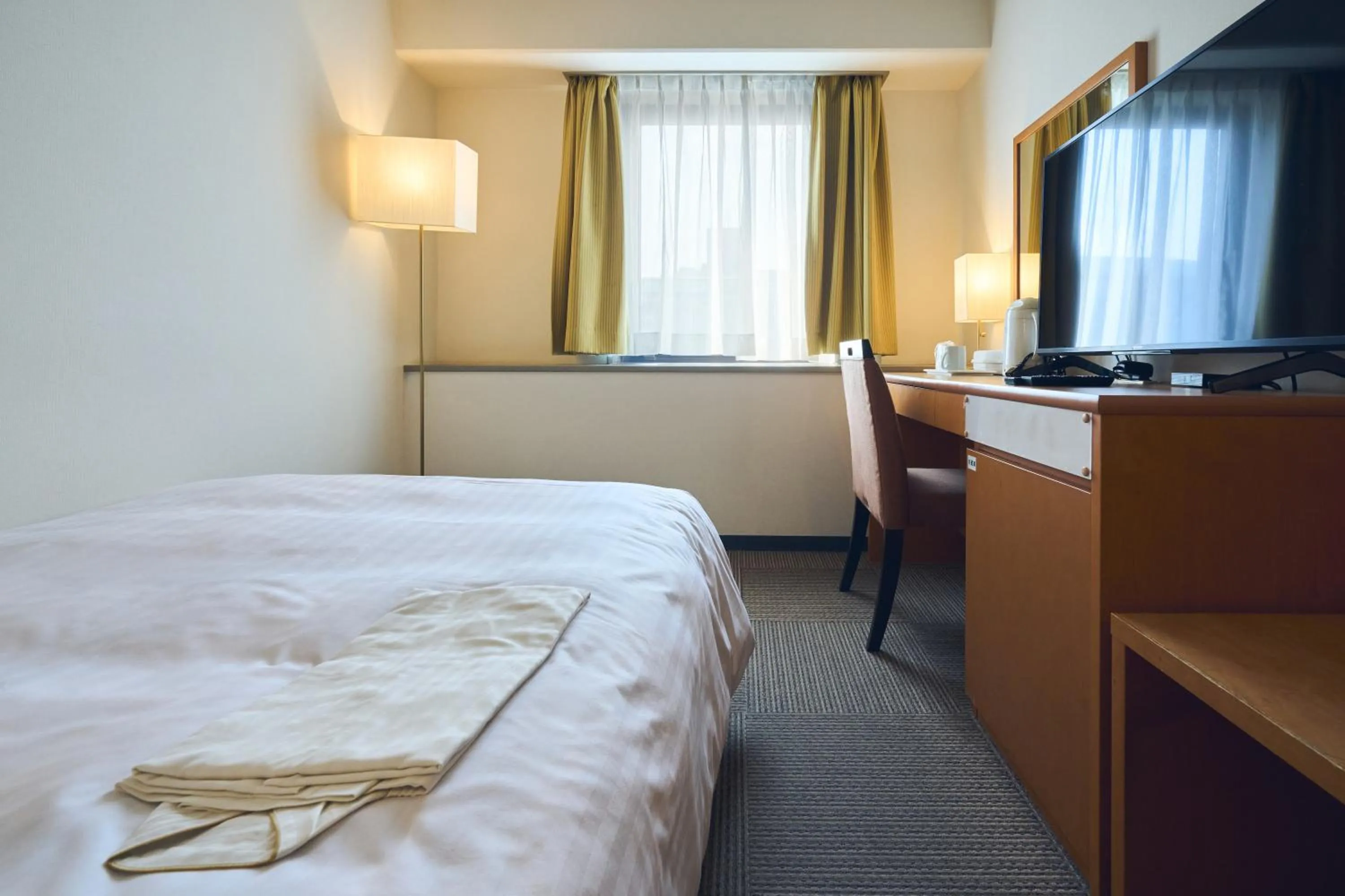 Photo of the whole room, Bed in Hotel Lexton Kagoshima