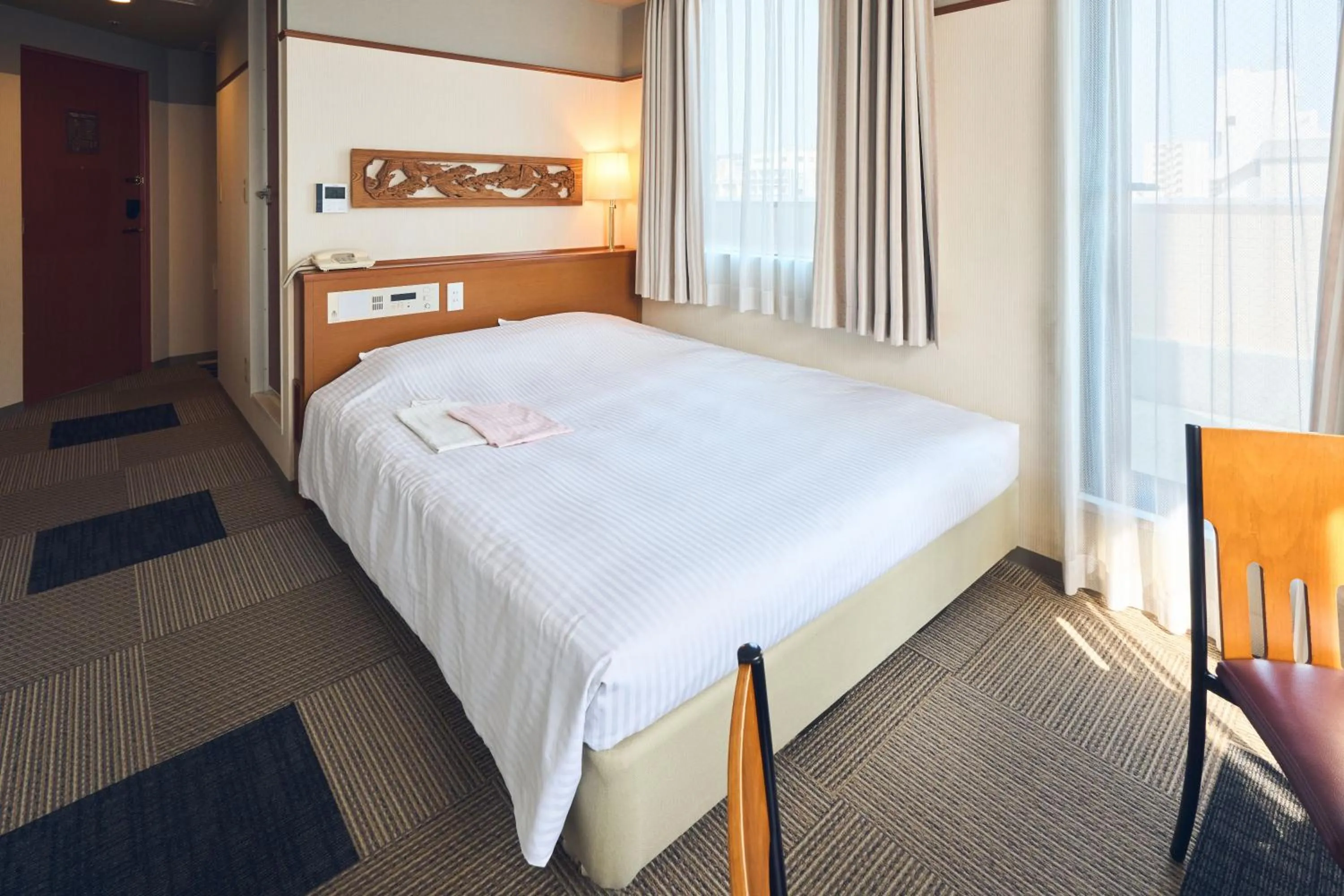 Photo of the whole room, Bed in Hotel Lexton Kagoshima