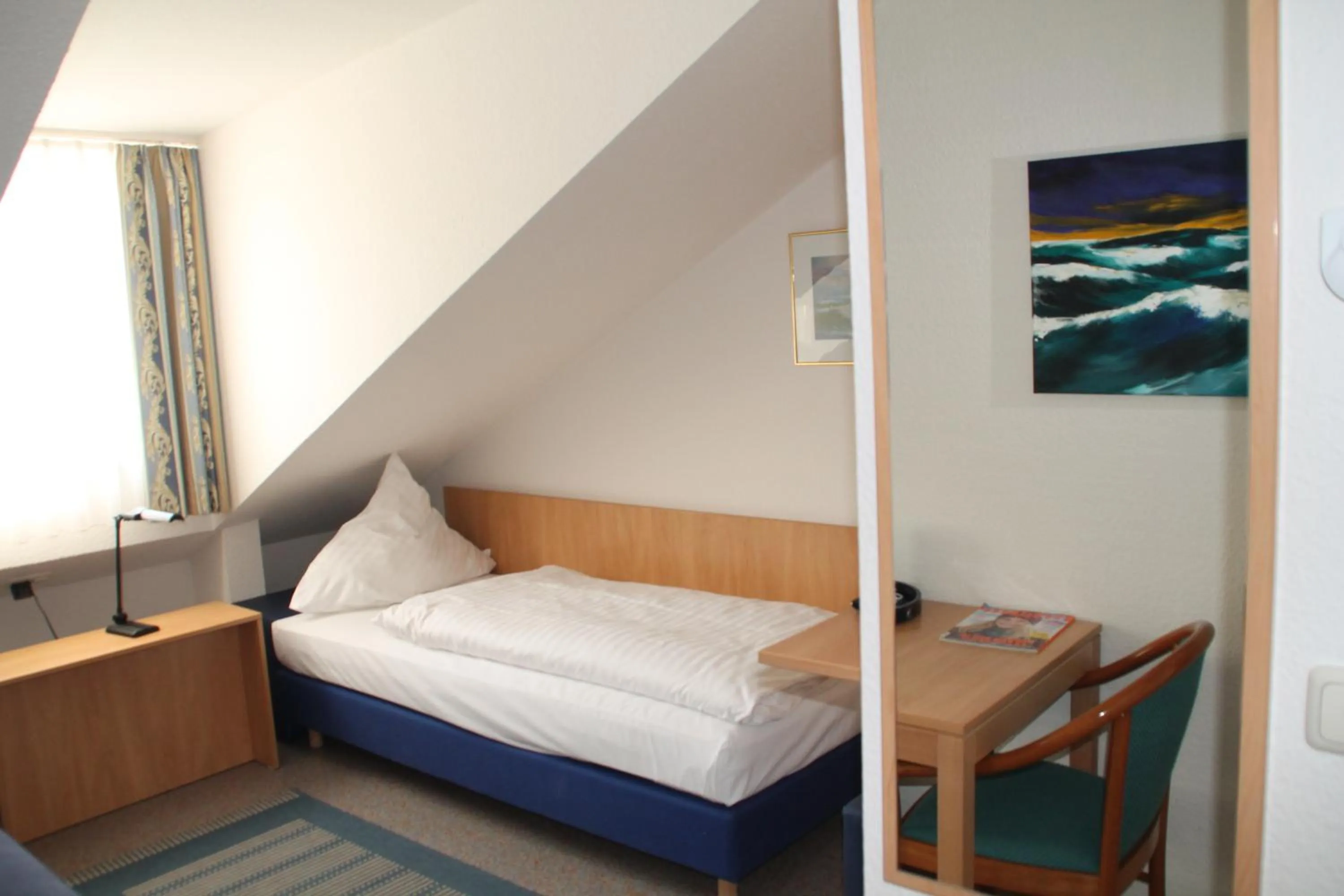 Photo of the whole room, Bed in RIESENjunior Hanau by Trip Inn