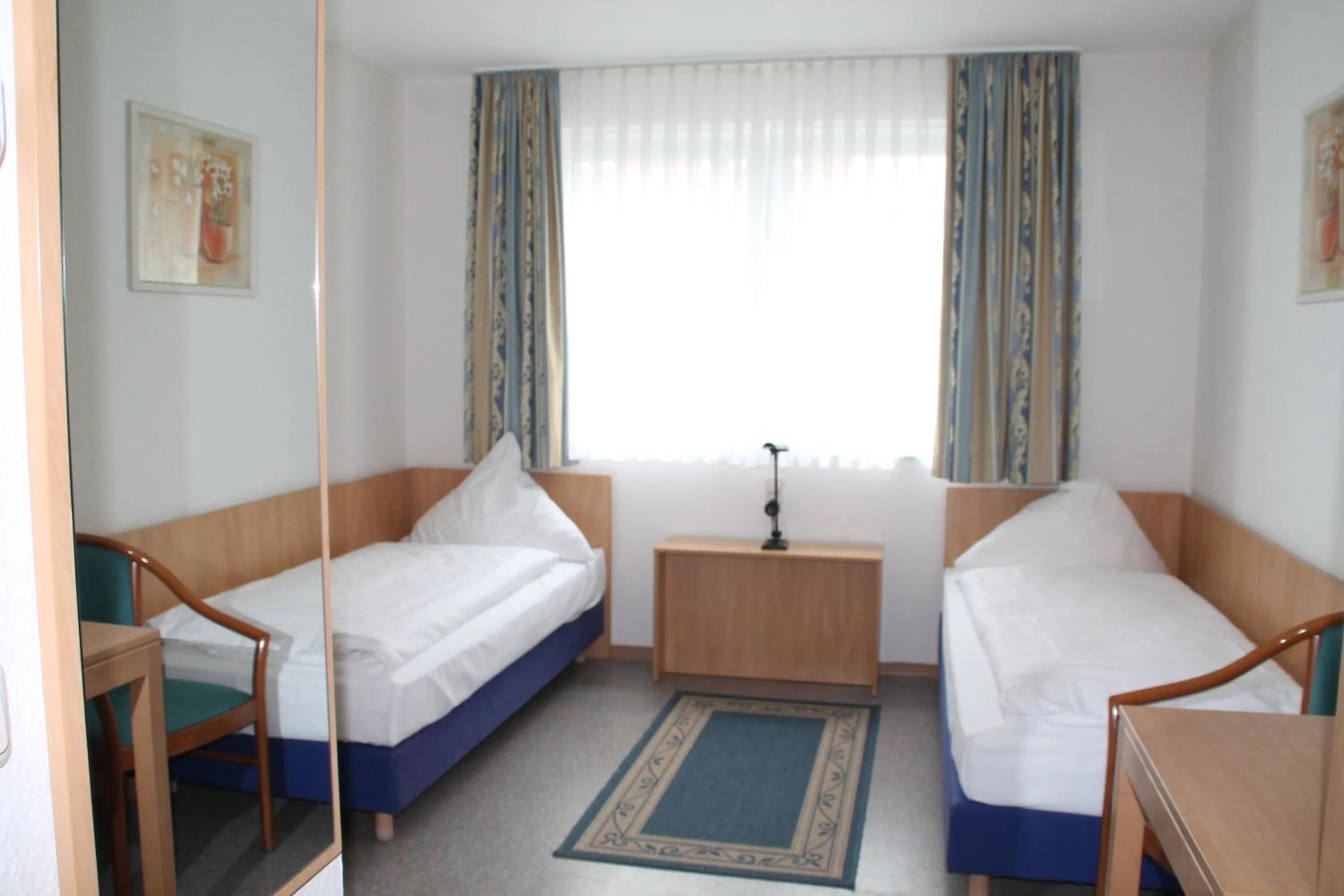 Photo of the whole room, Bed in RIESENjunior Hanau by Trip Inn