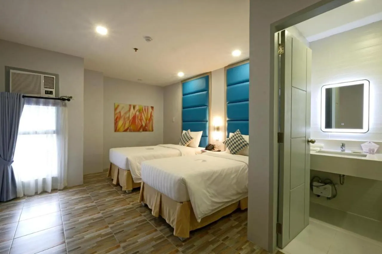 Bed in Amethyst Boutique Hotel Cebu powered by Cocotel