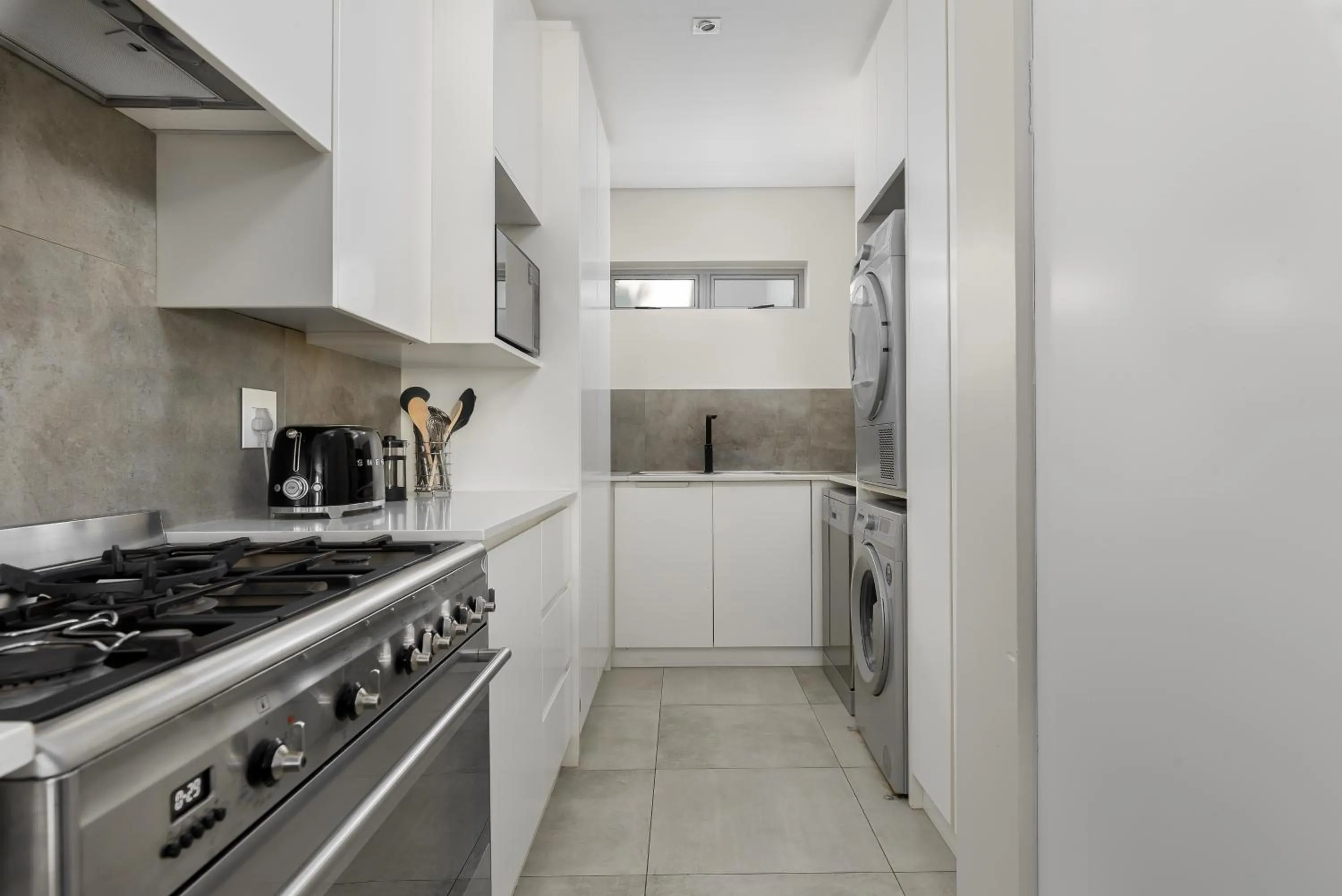 kitchen in Elements Luxury Suites by Totalstay