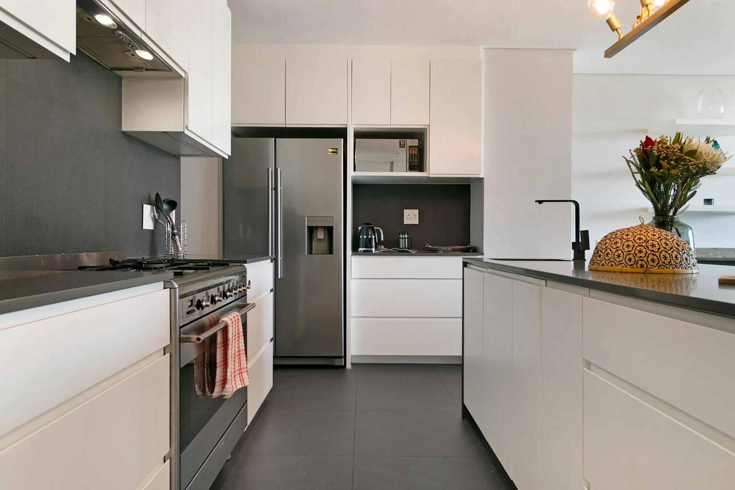 kitchen in Elements Luxury Suites by Totalstay