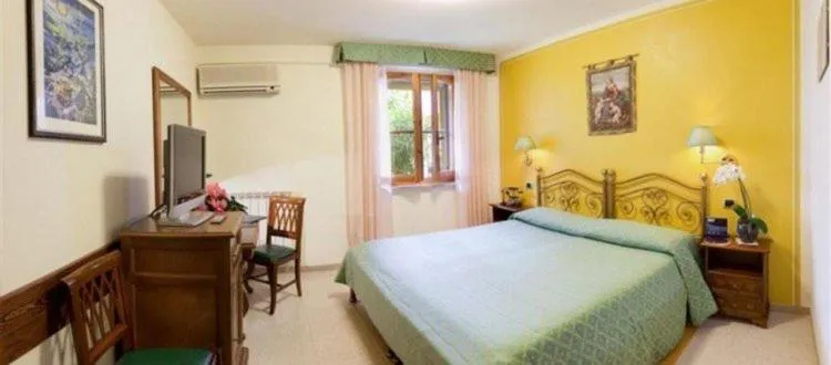 Bed in Campiglione Hotel