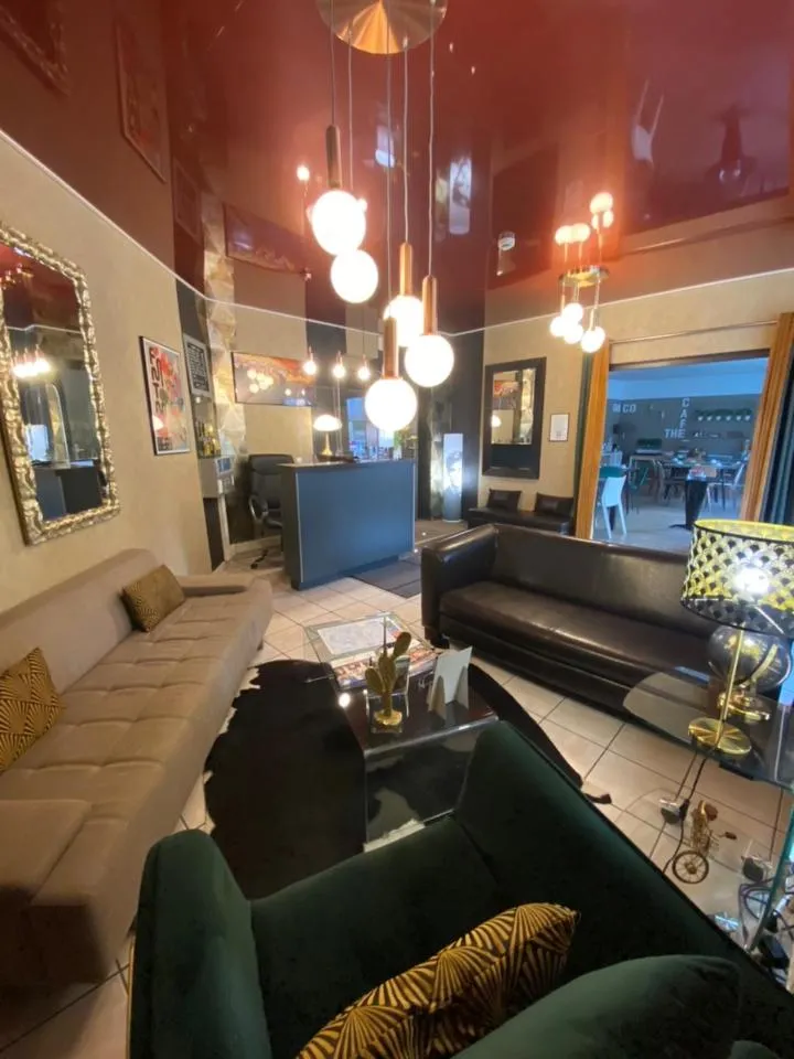 Communal lounge/ TV room in Cesar Hotel