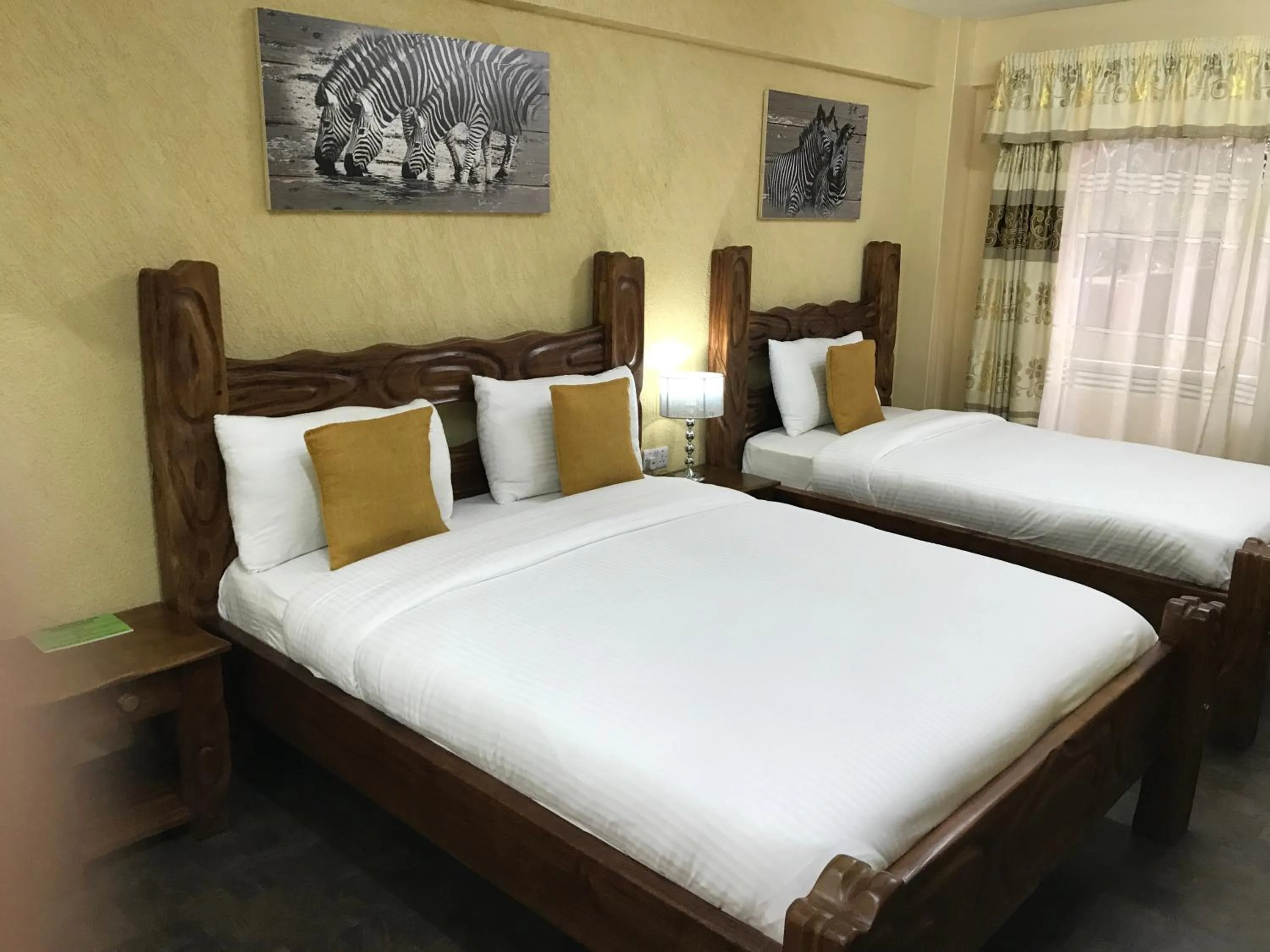 Bed in Progressive Park Hotel