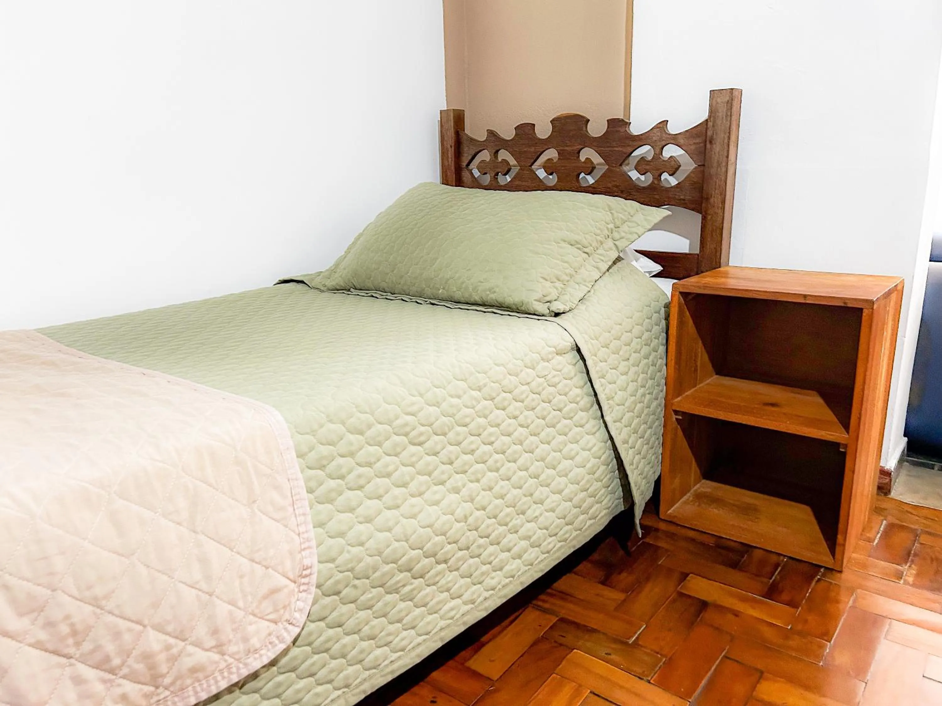 Bed in Pousada dos Sinos