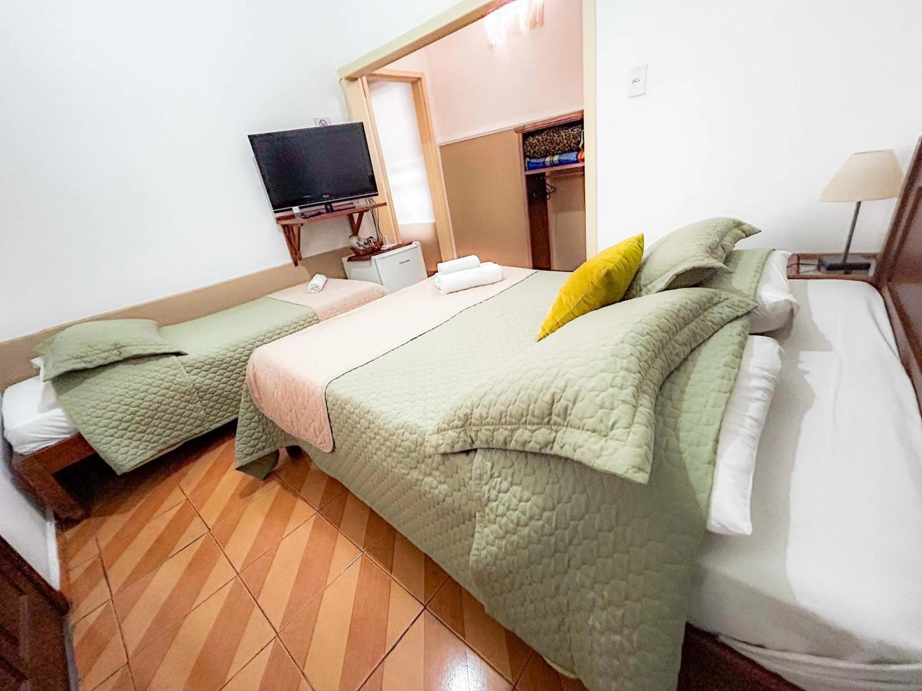 Bed in Pousada dos Sinos