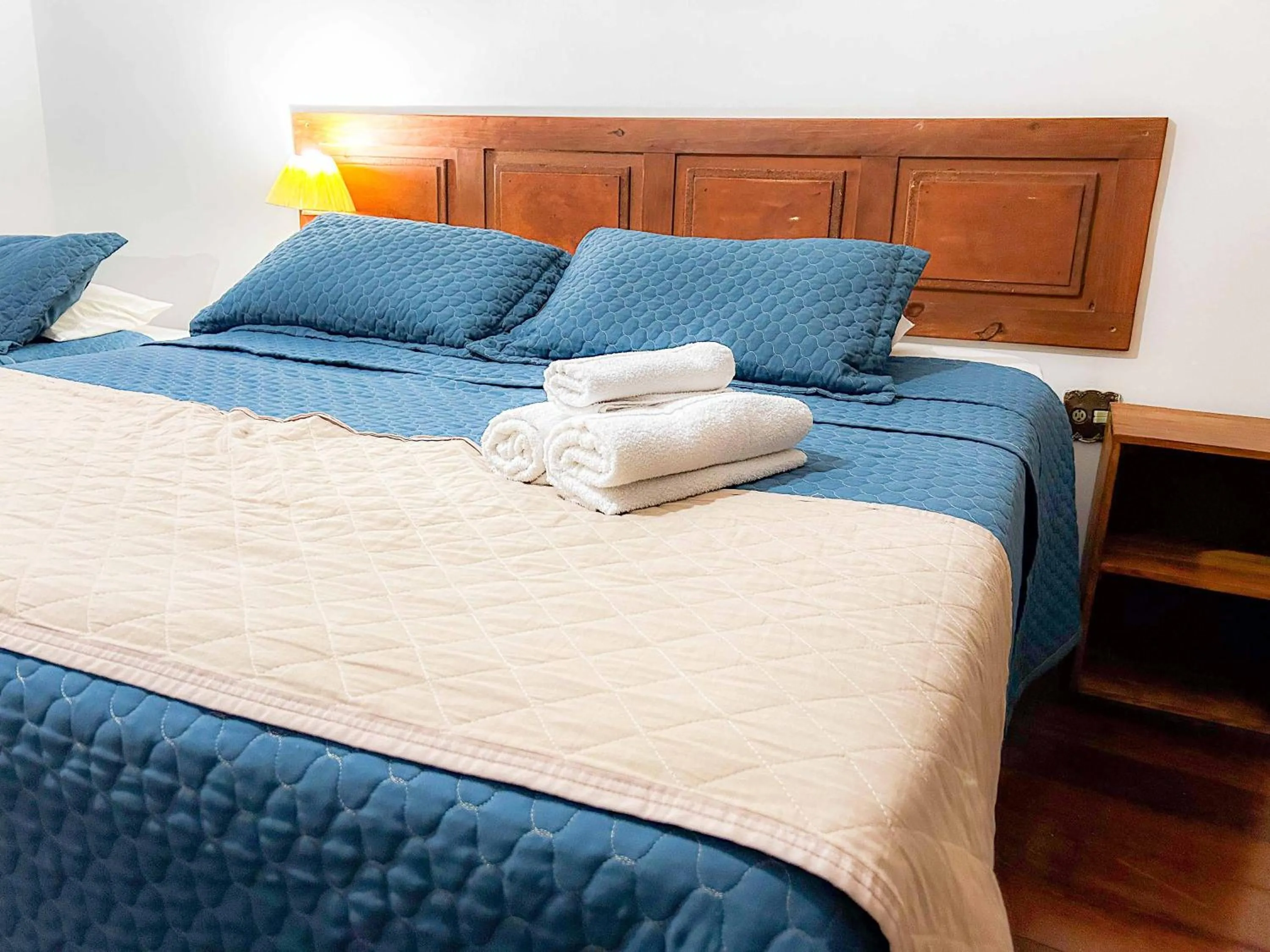 Bed in Pousada dos Sinos