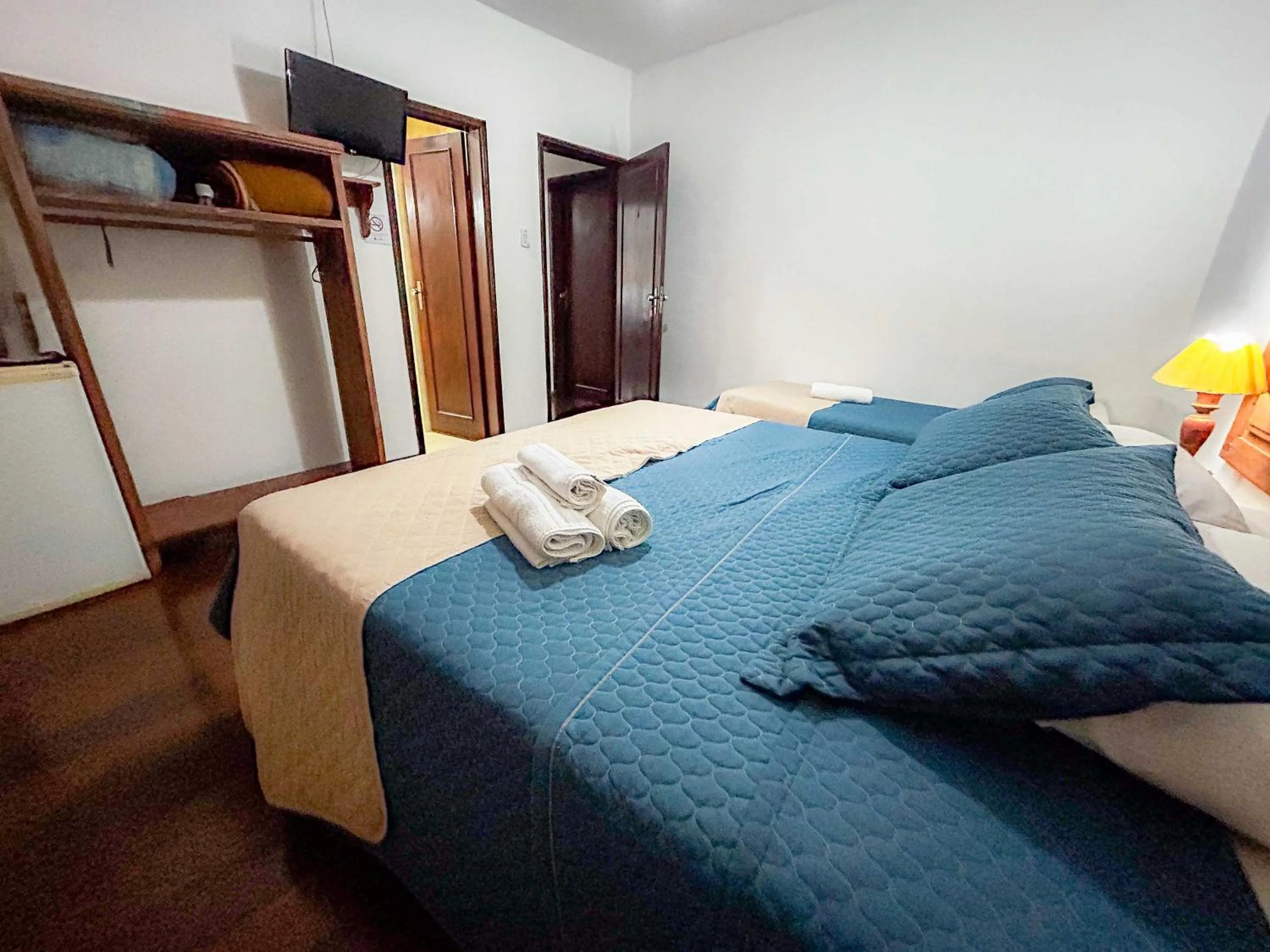 Bed in Pousada dos Sinos