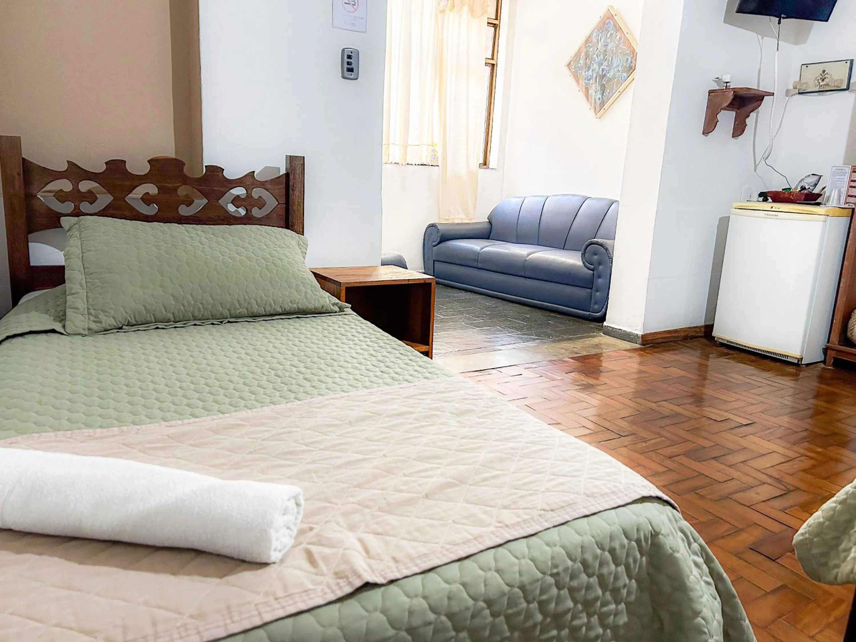 Bed in Pousada dos Sinos