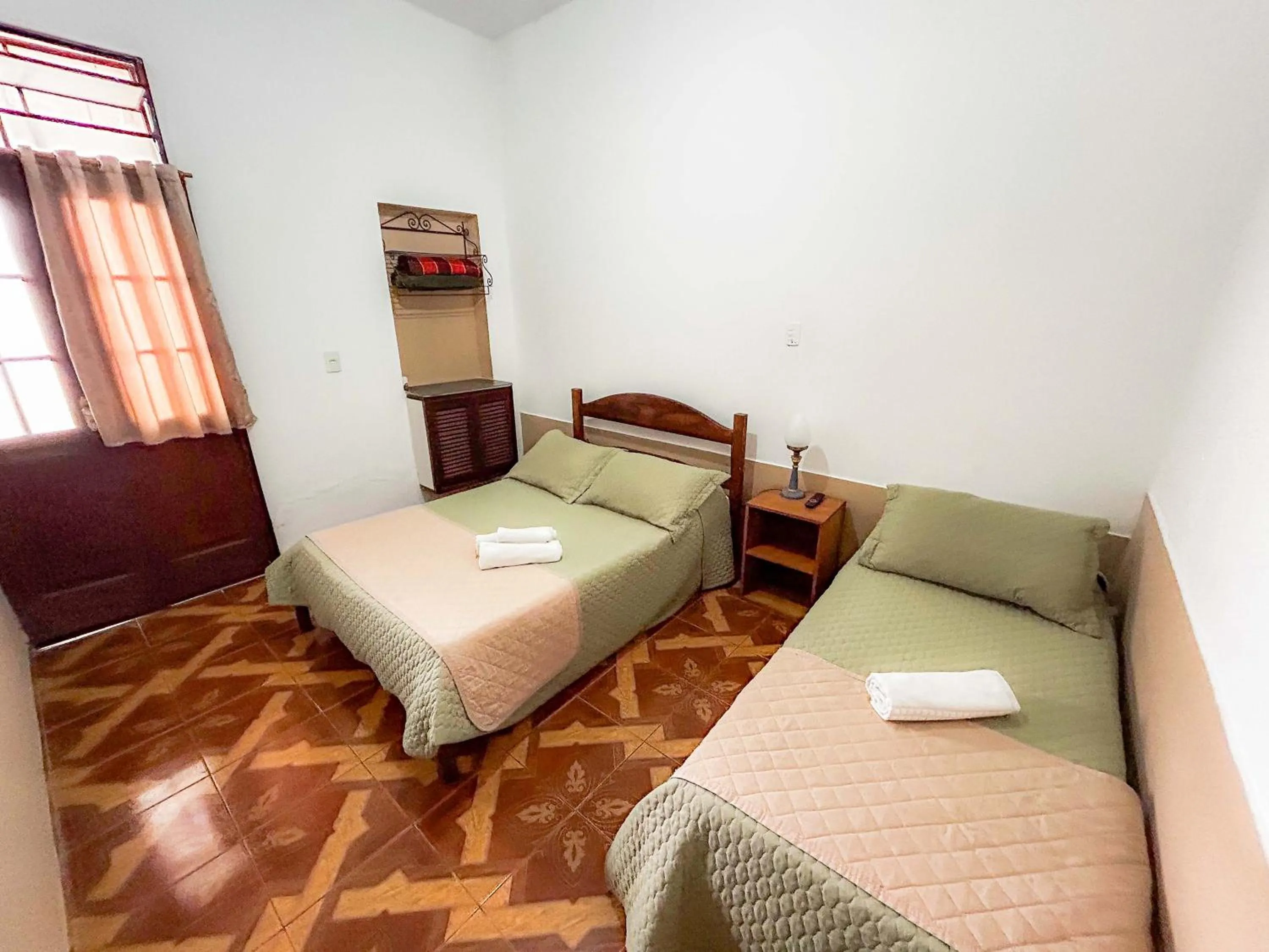 Bed in Pousada dos Sinos