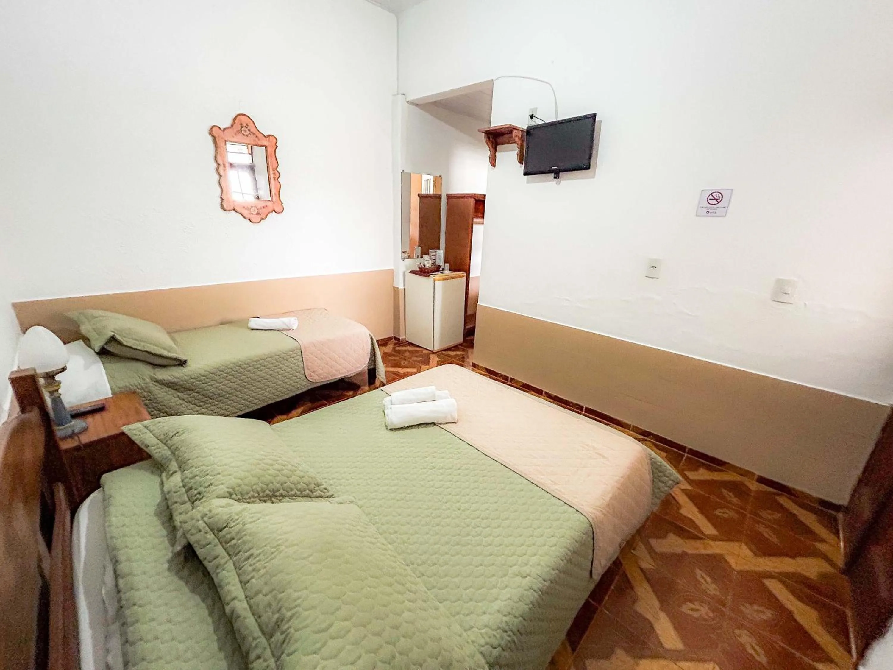 Bed in Pousada dos Sinos