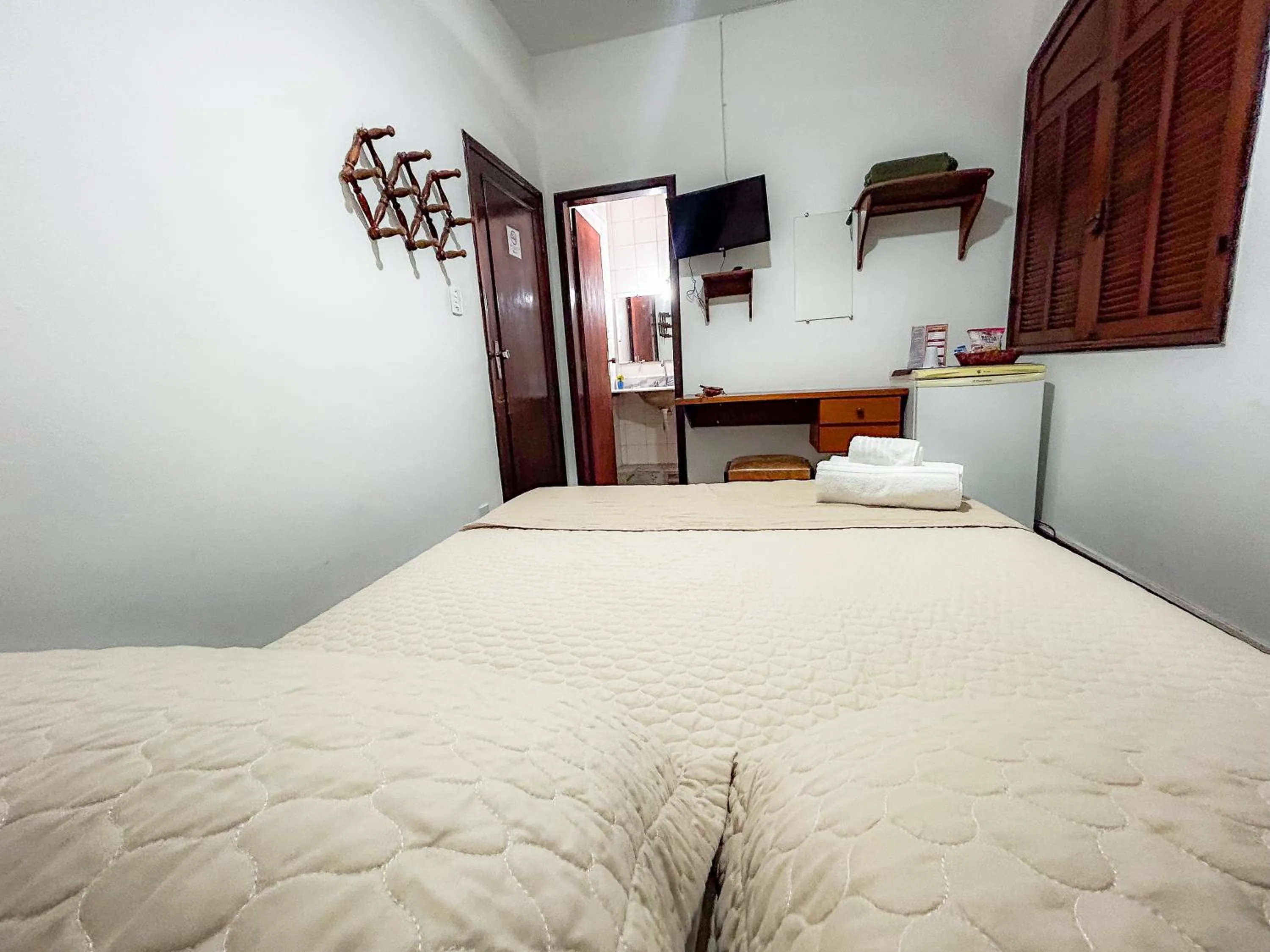 Bed in Pousada dos Sinos