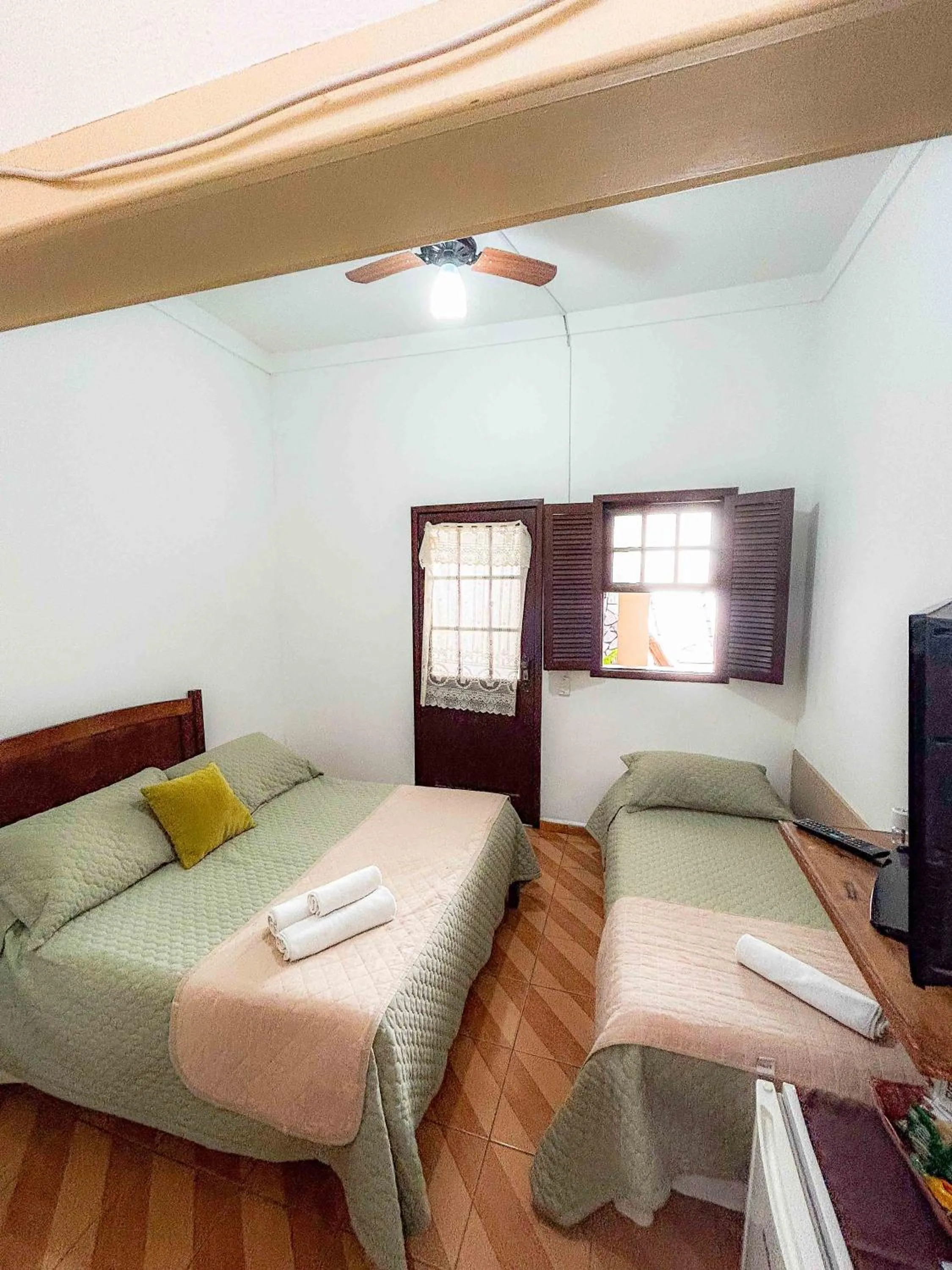 Bed in Pousada dos Sinos