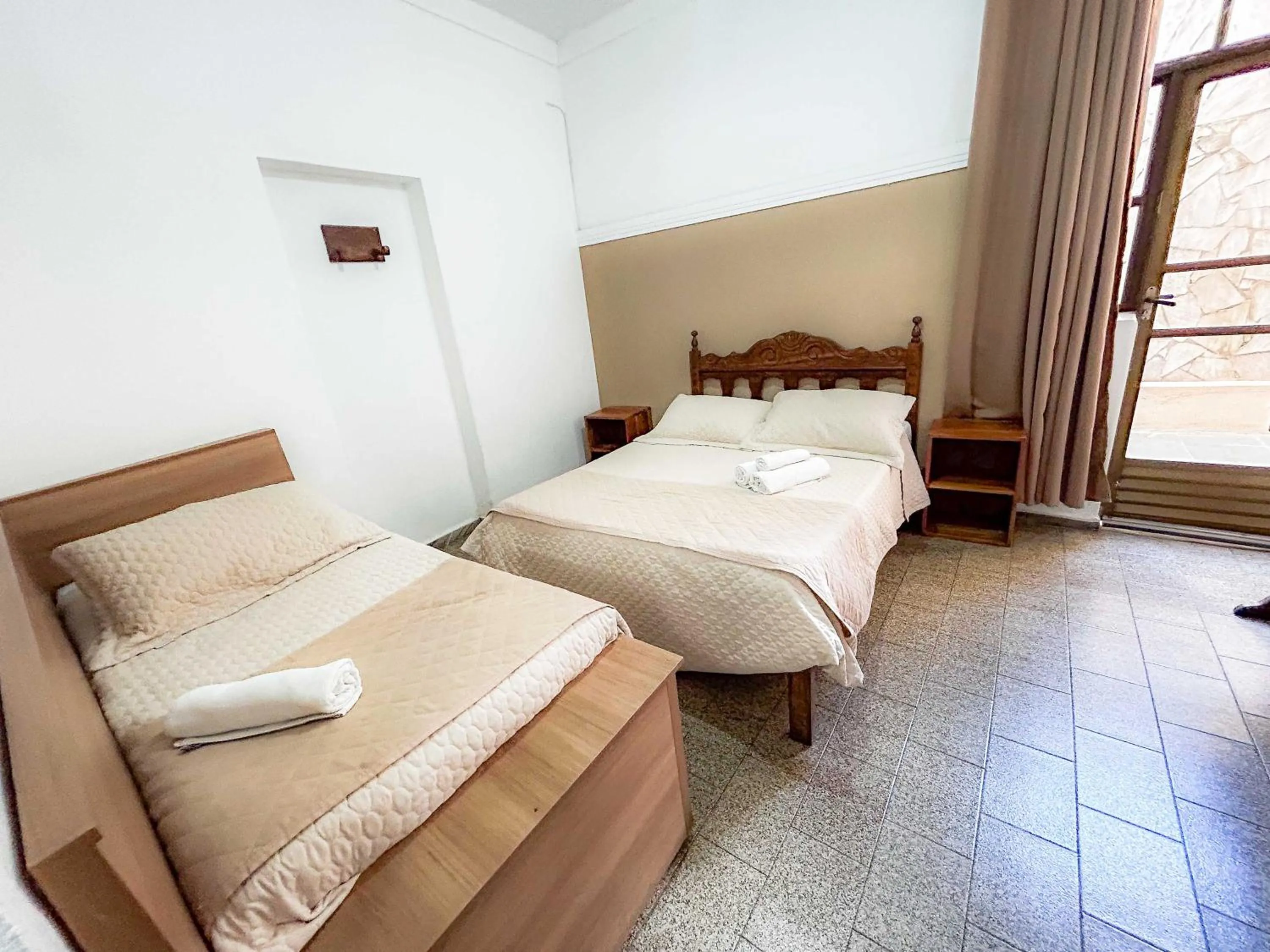 Bed in Pousada dos Sinos