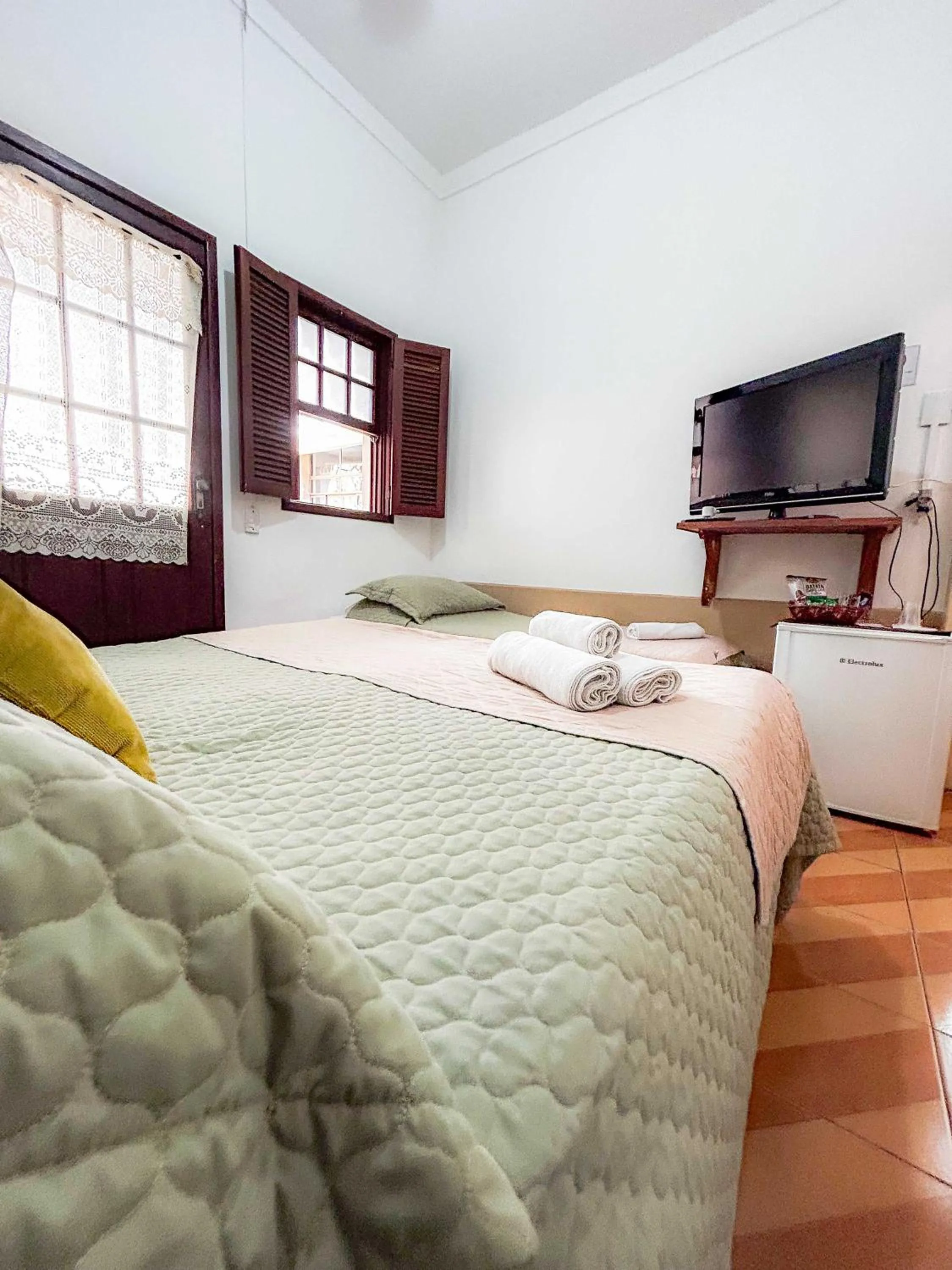 Bed in Pousada dos Sinos