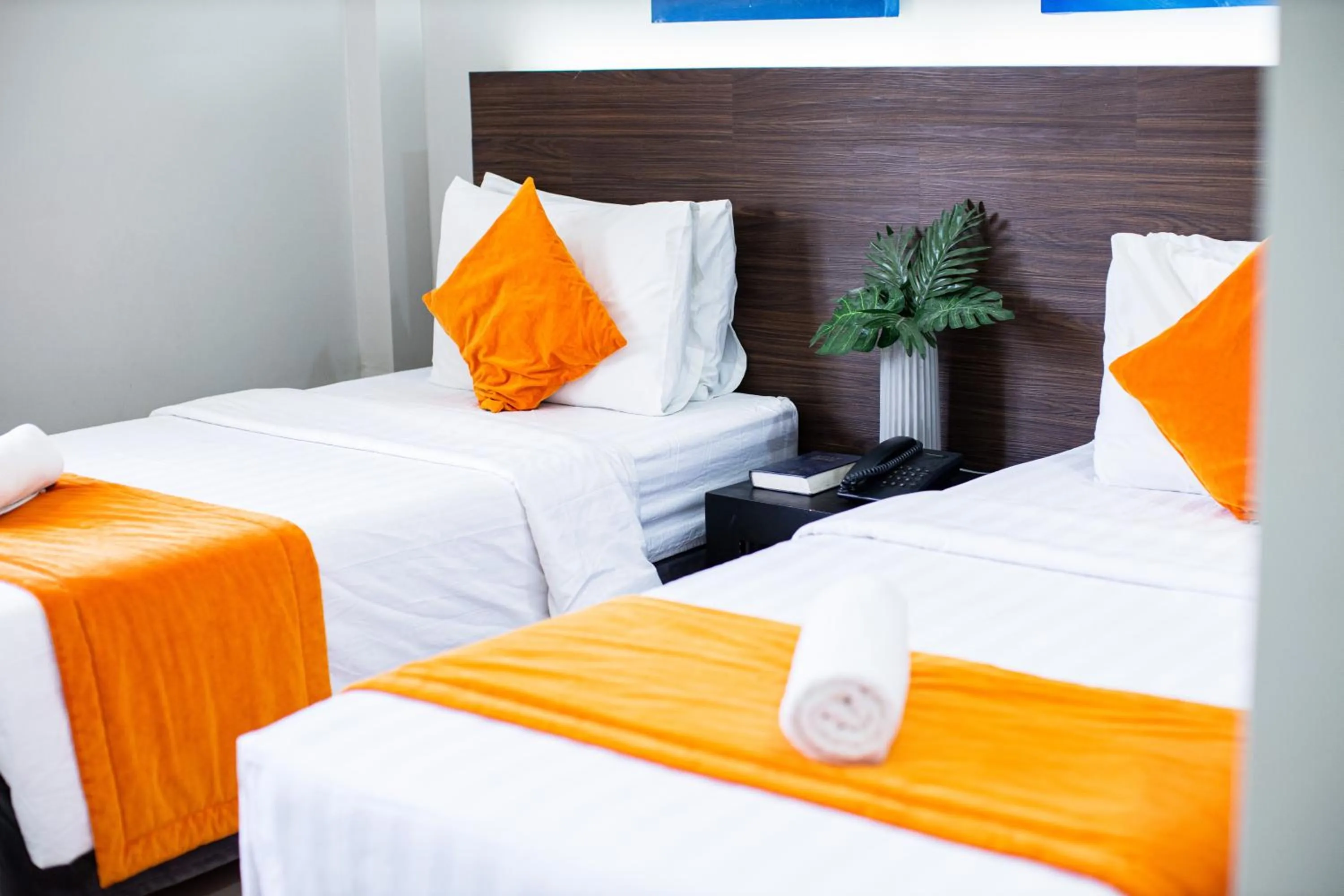 Bed in Holiday Suites Puerto Princesa