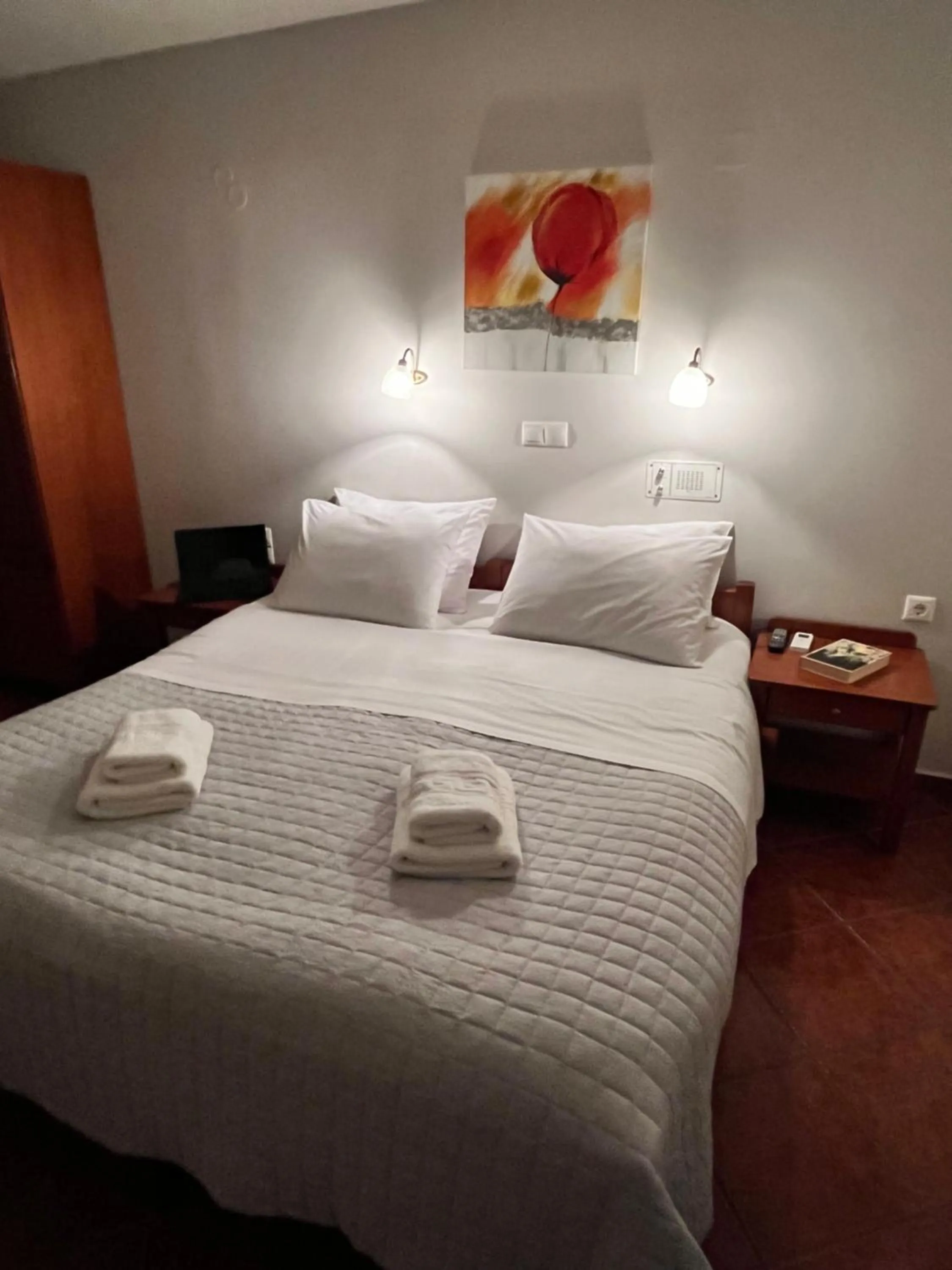 Bed in Iolkos Hotel Apartments