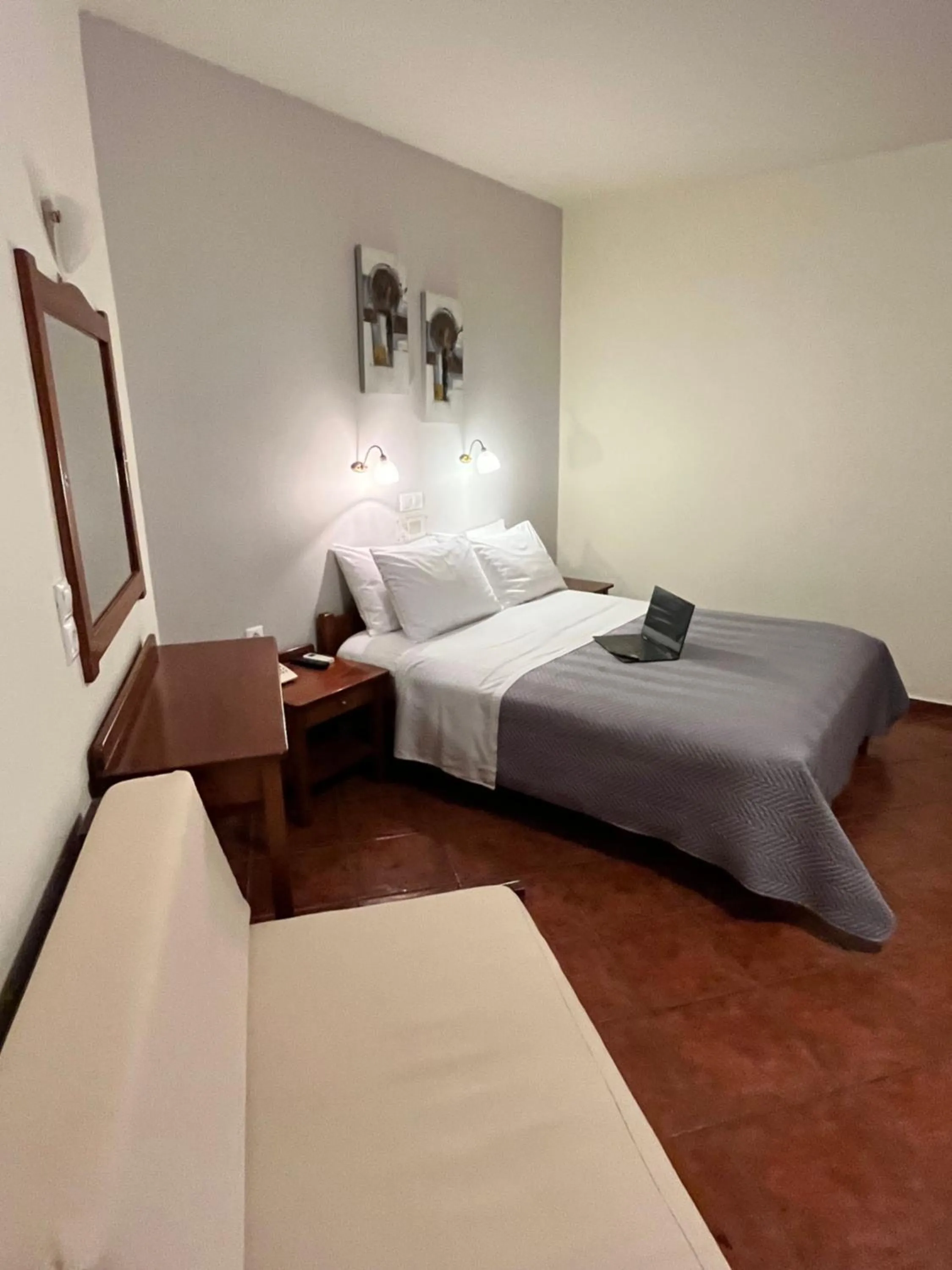 Bed in Iolkos Hotel Apartments